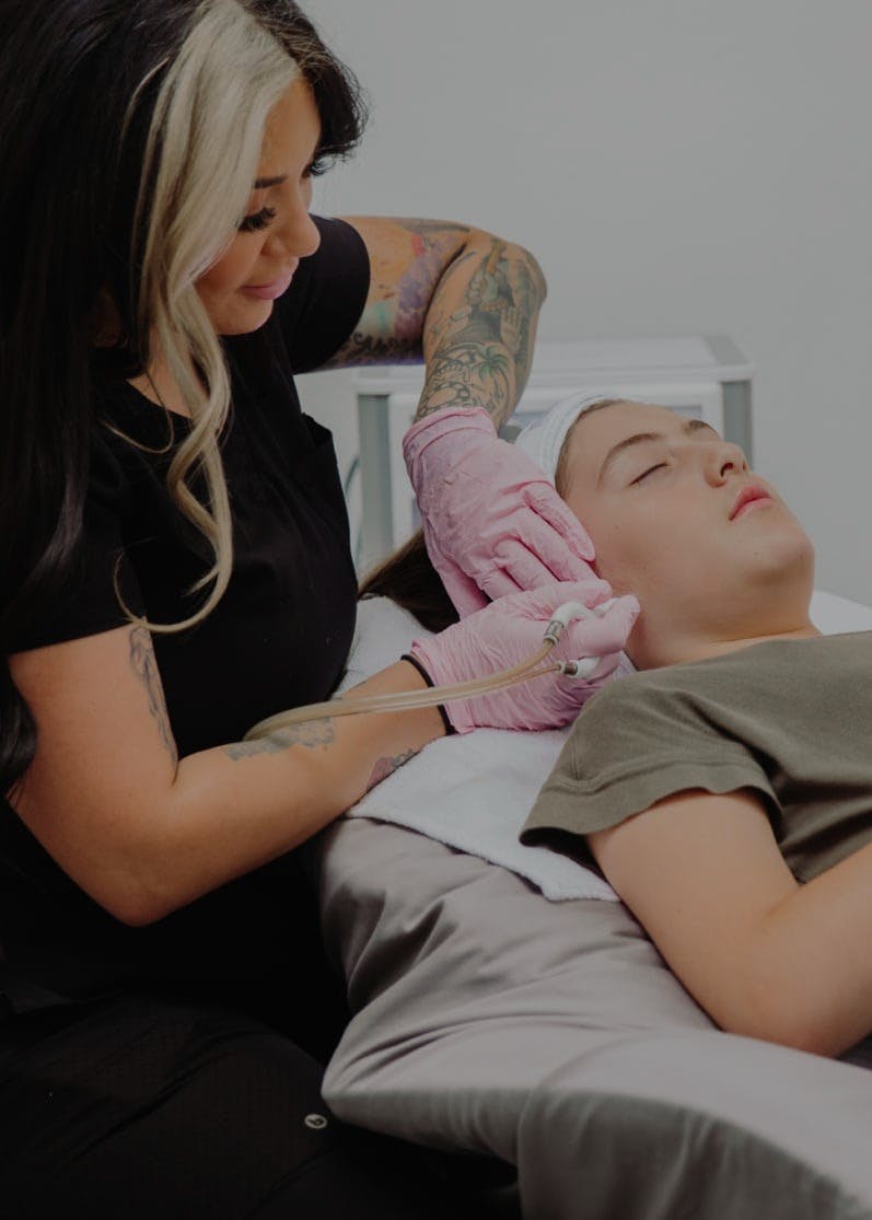 A patient receiving treatment at Flawless Med Spa.