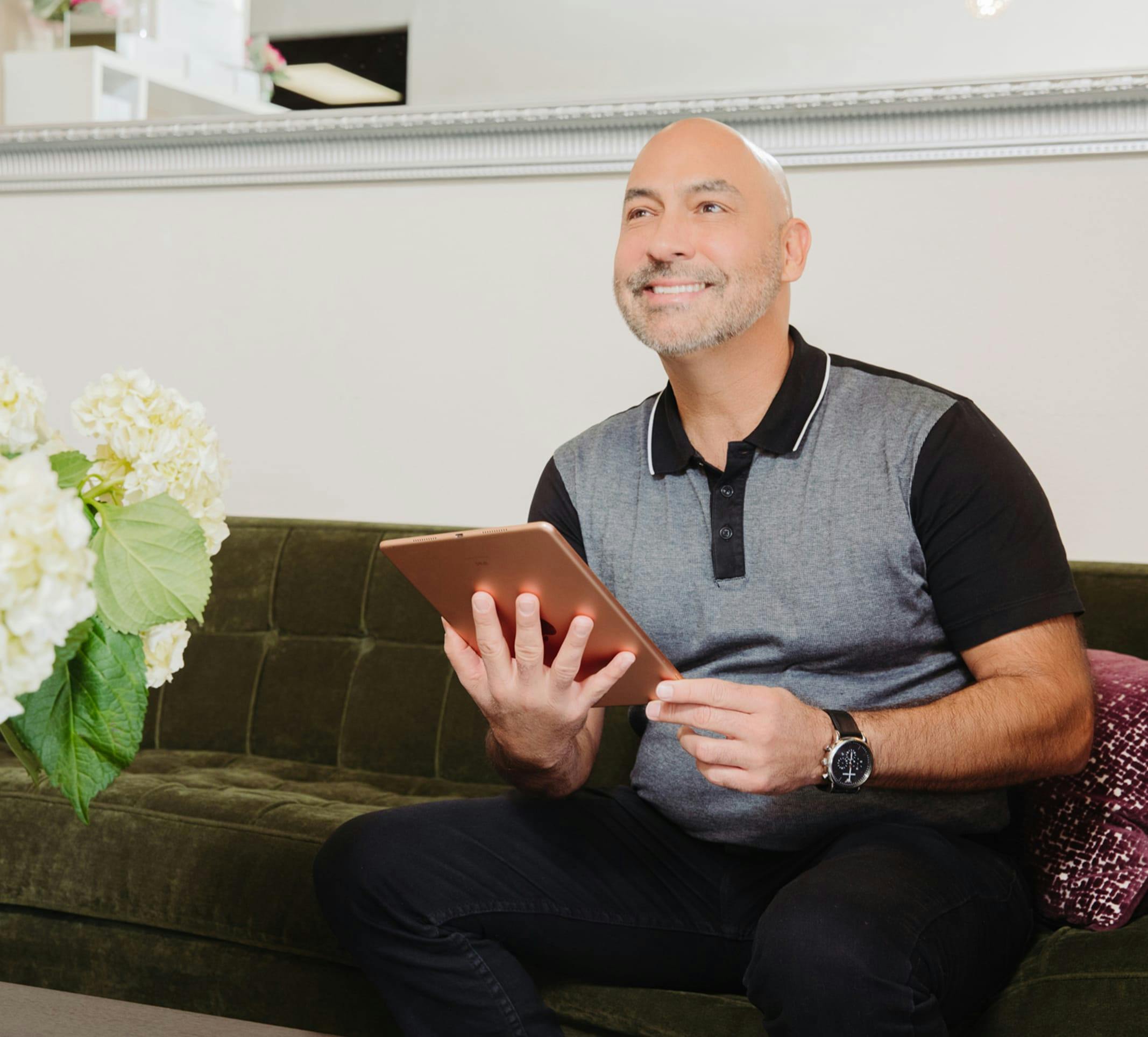 man holding a tablet