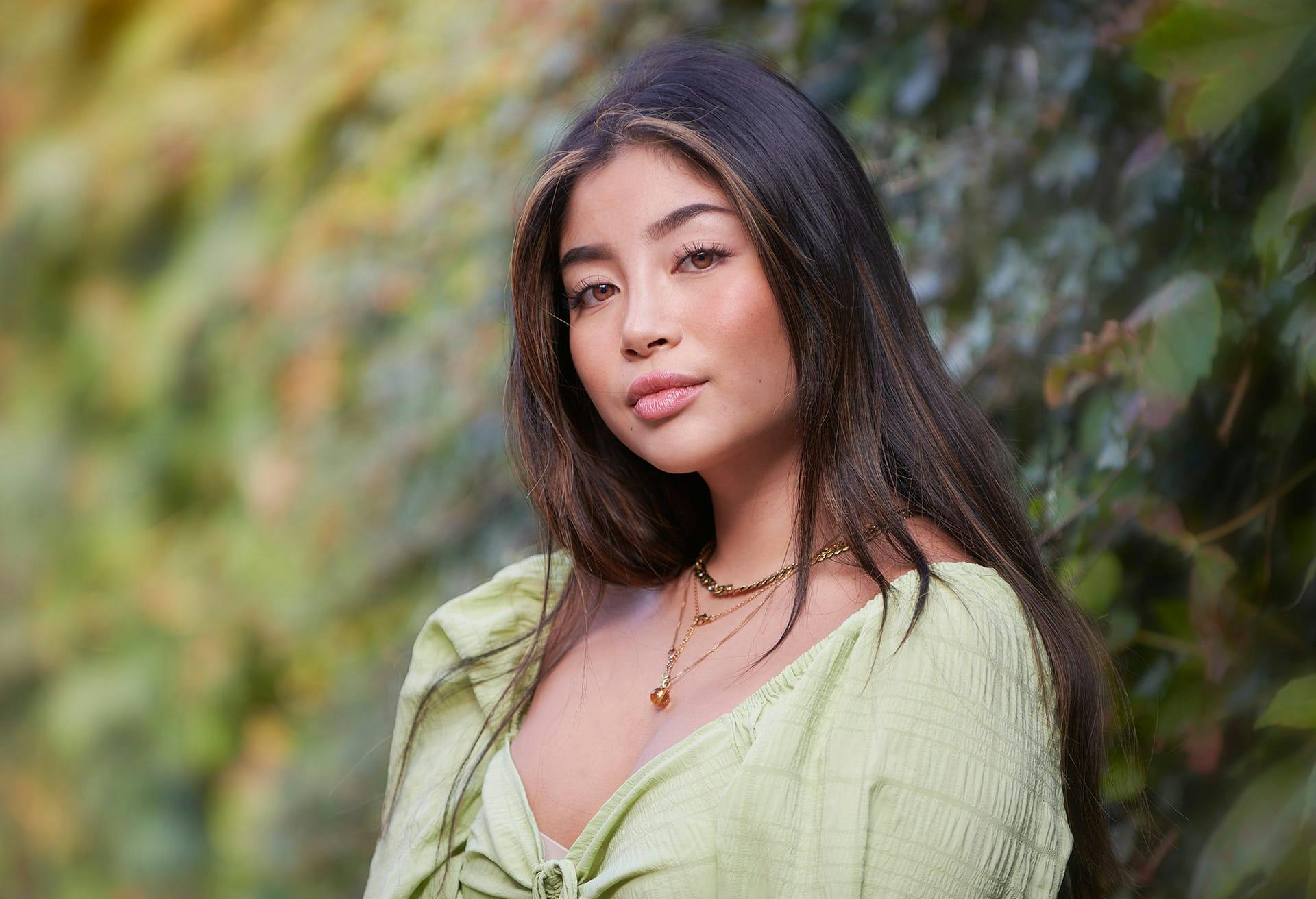 woman in a green top