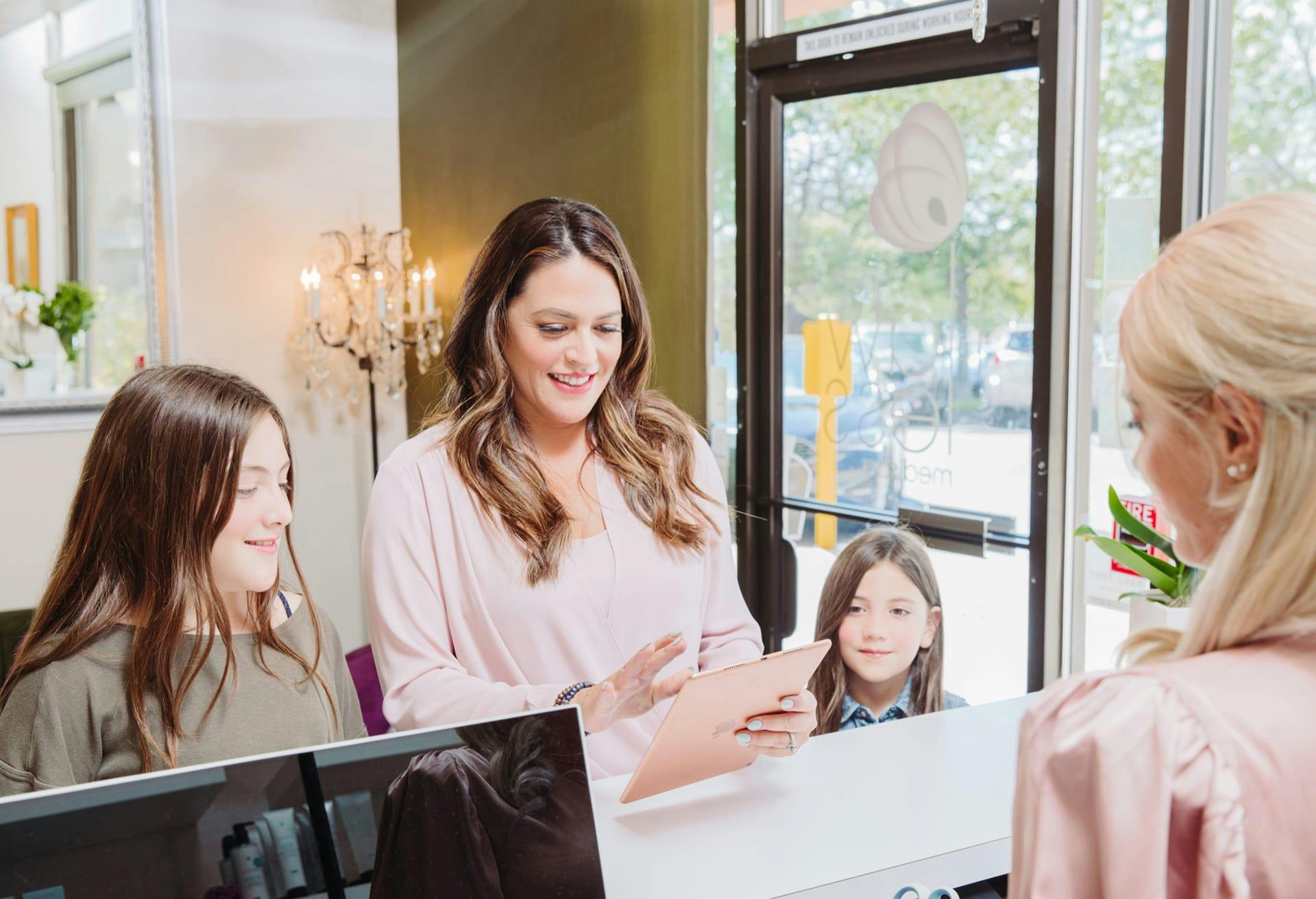 family at checkout desk