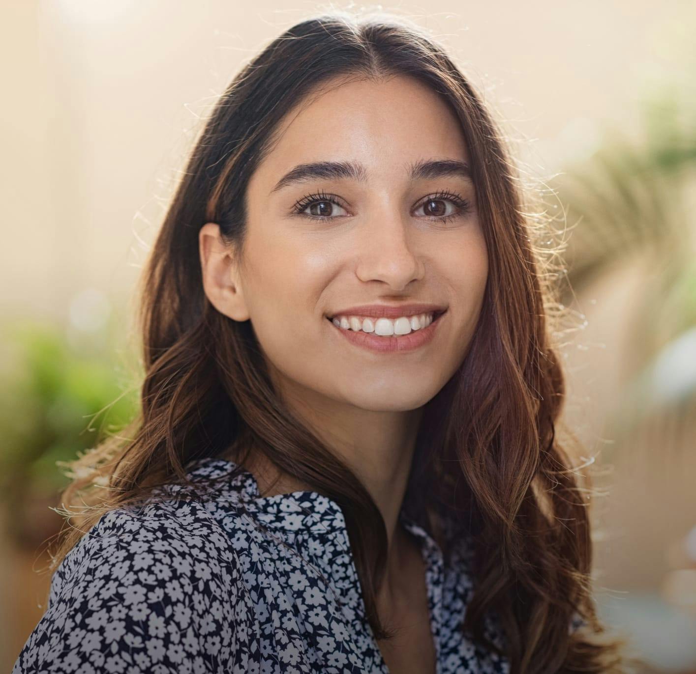Closeup of a smiling woman's face.