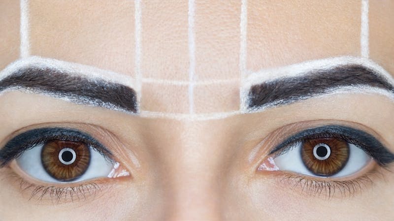 womans eyebrows prepped for microblading treatment