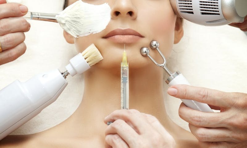 woman's face with various items around it