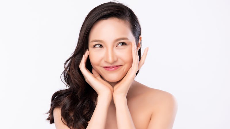 there is a woman posing with her hands on her face