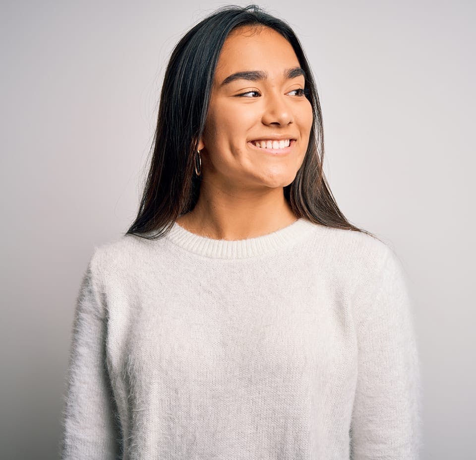 woman wearing a cream colored sweater