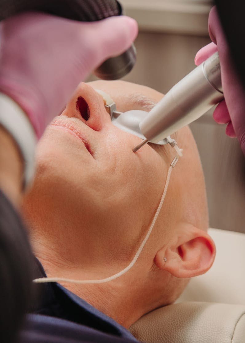 A man receiving treatment at Flawless Med Spa.
