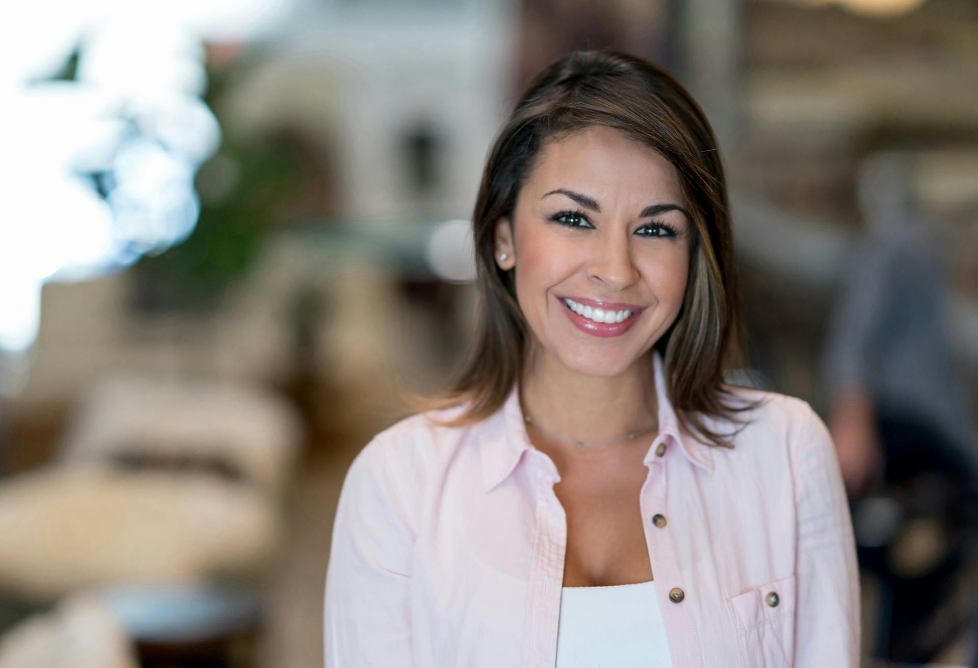 woman in a pink button up