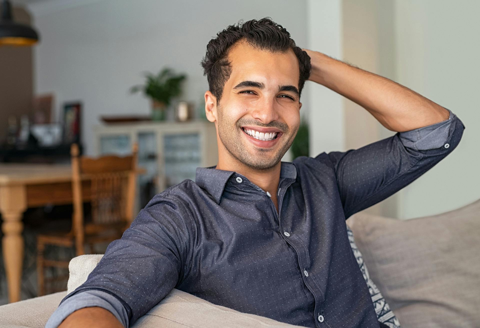 man in a dark blue button up shirt