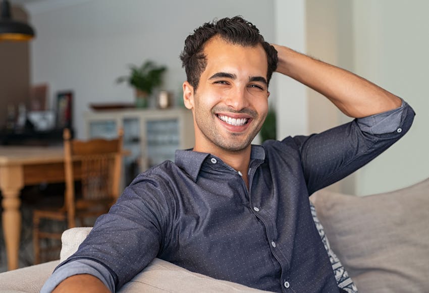 man in a dark blue button up shirt