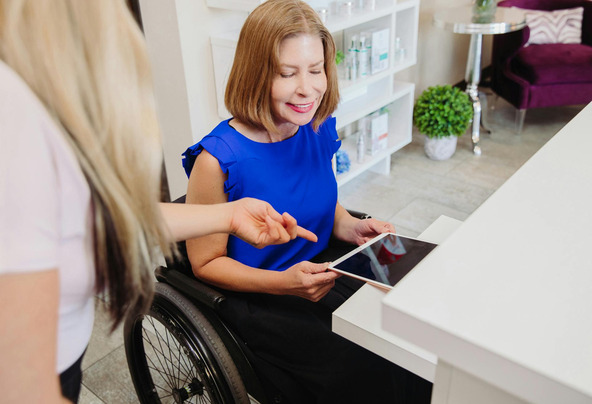 woman holding a tablet