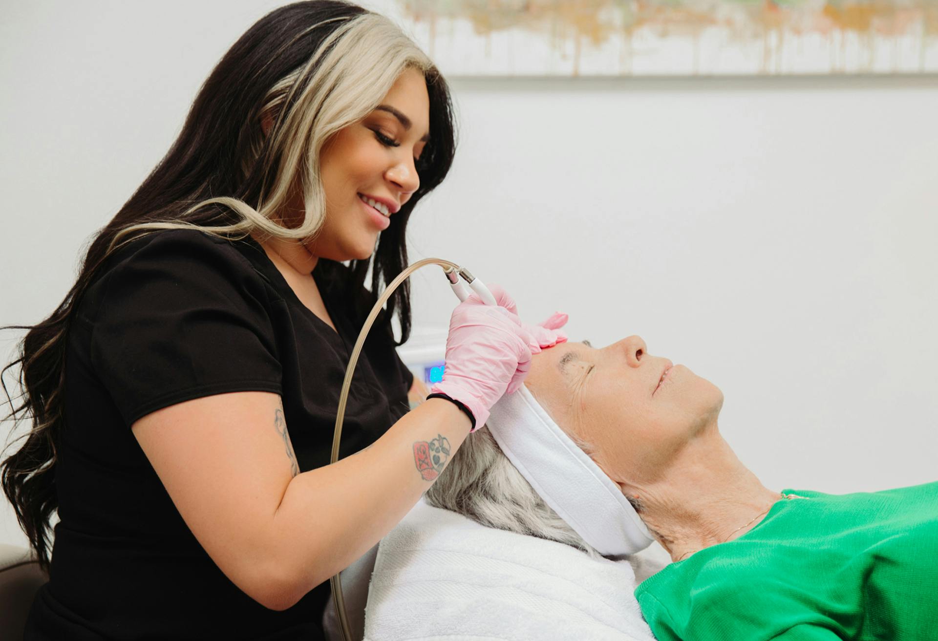 Older woman receiving a facial at Flawless Med Spa in Albuquerque