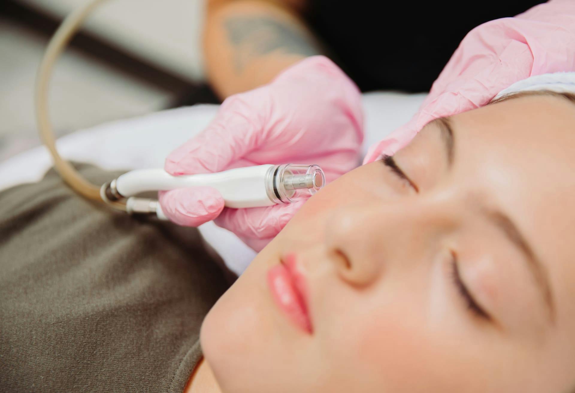 woman getting face treatment