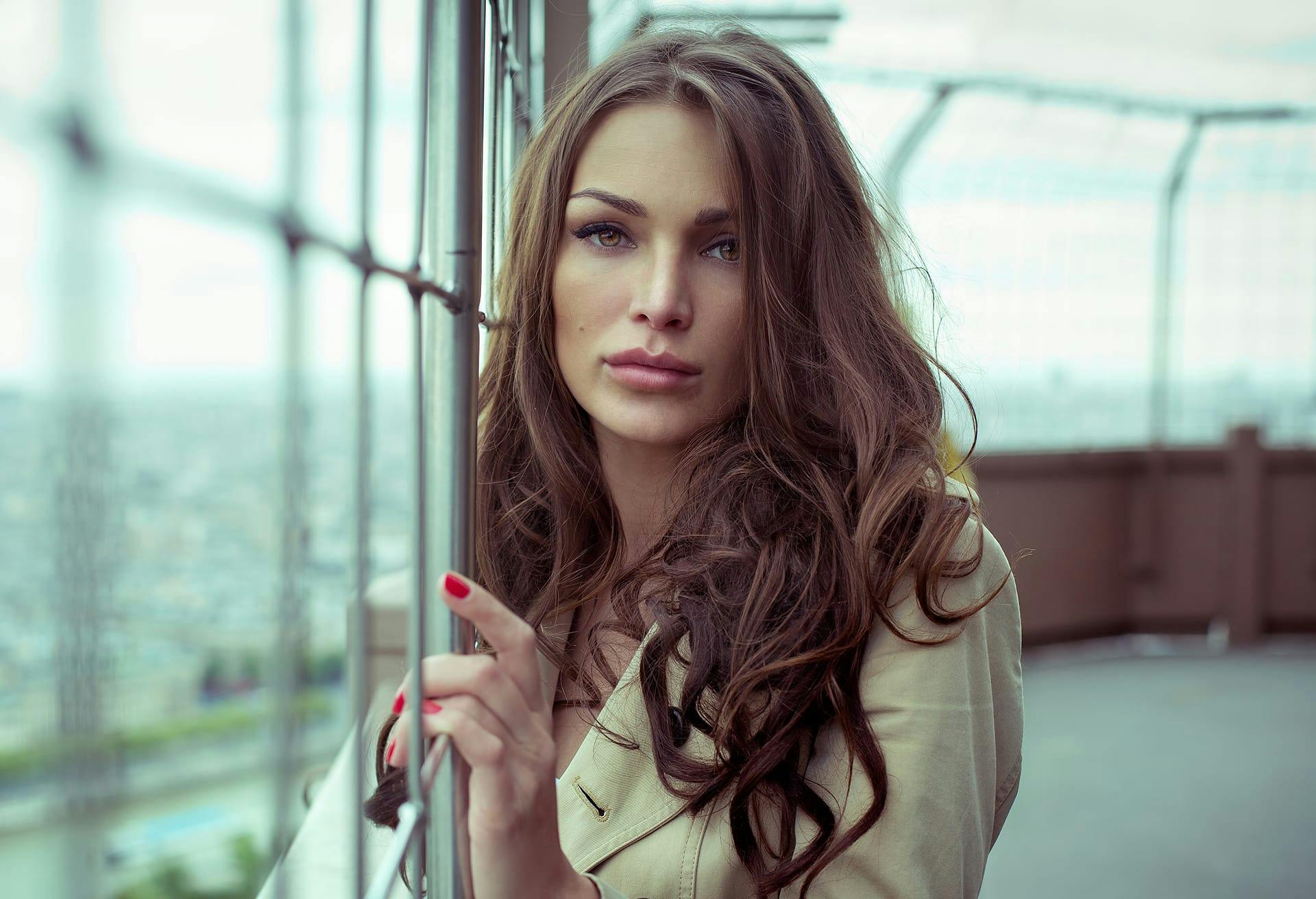 woman standing near a fence