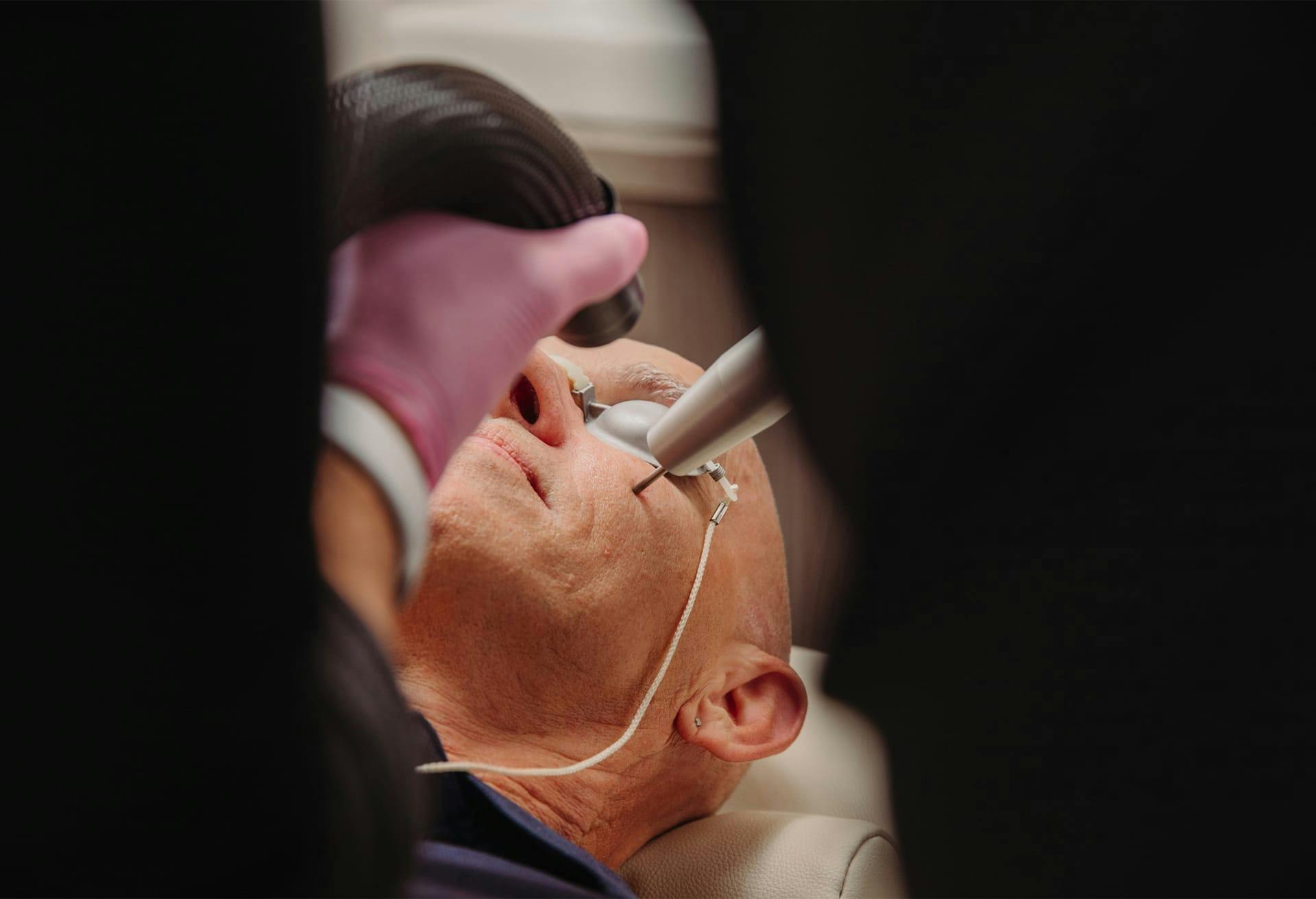 man getting facial rejuvenation treatment