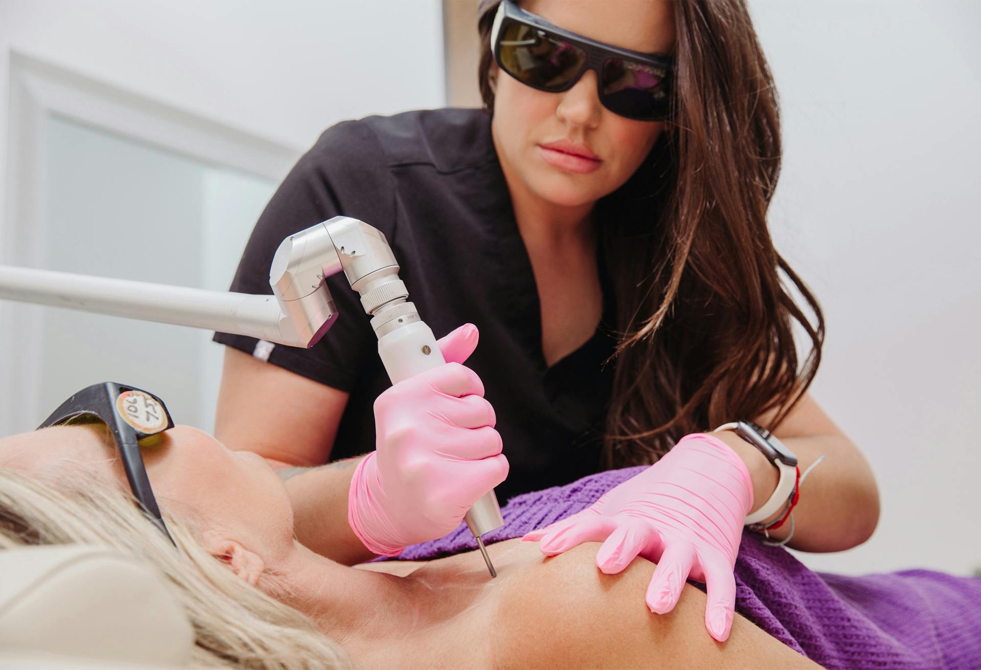 Patient receiving laser treatment at Flawless Med Spa