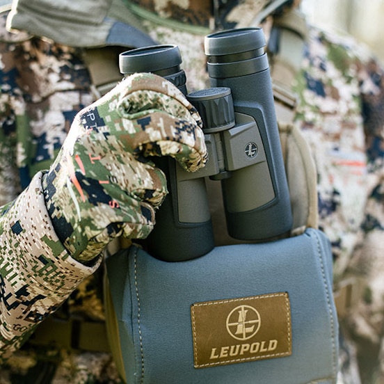 Hunter using Leupolod binoculars