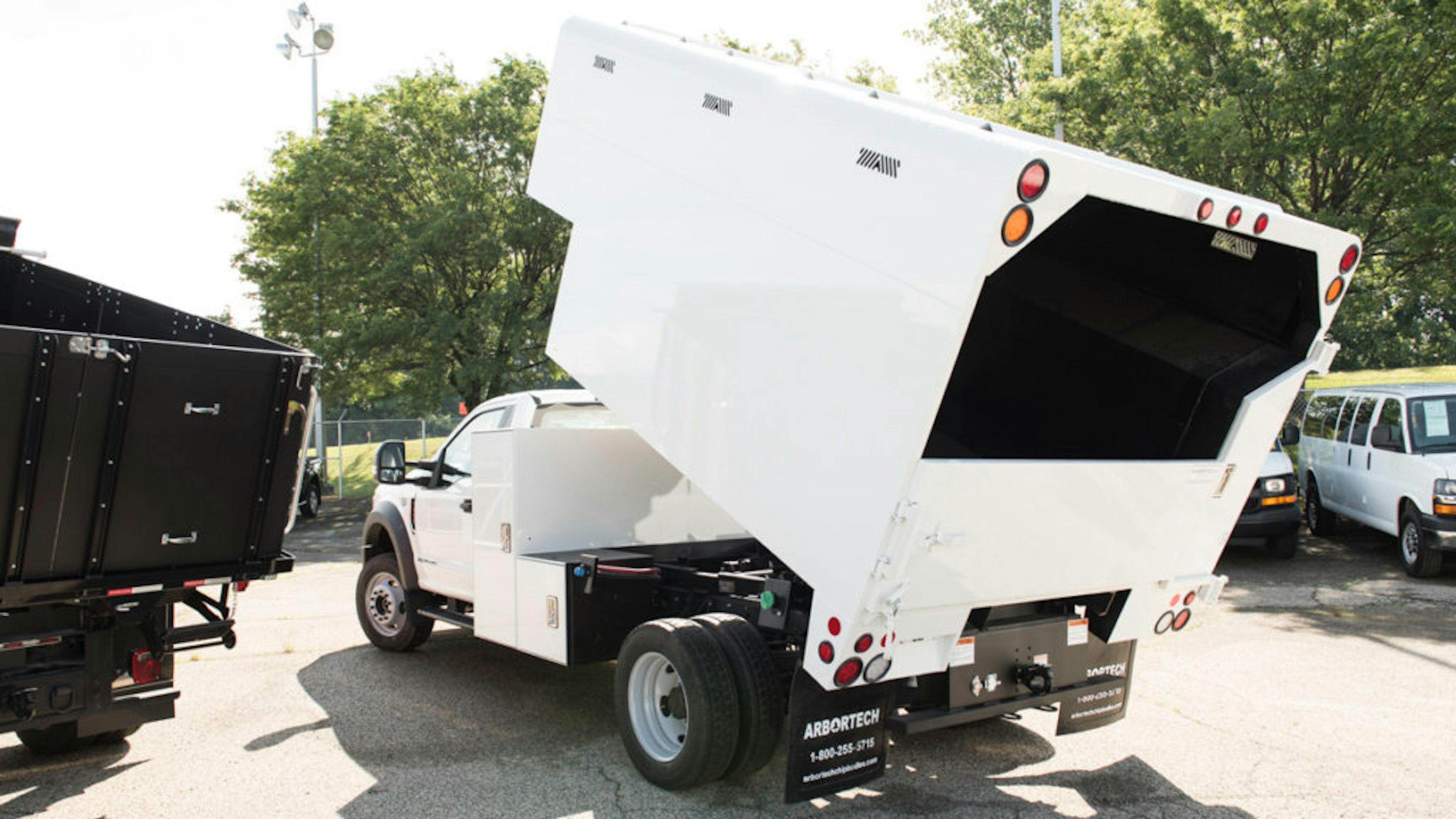 Landscape enclosed dump truck