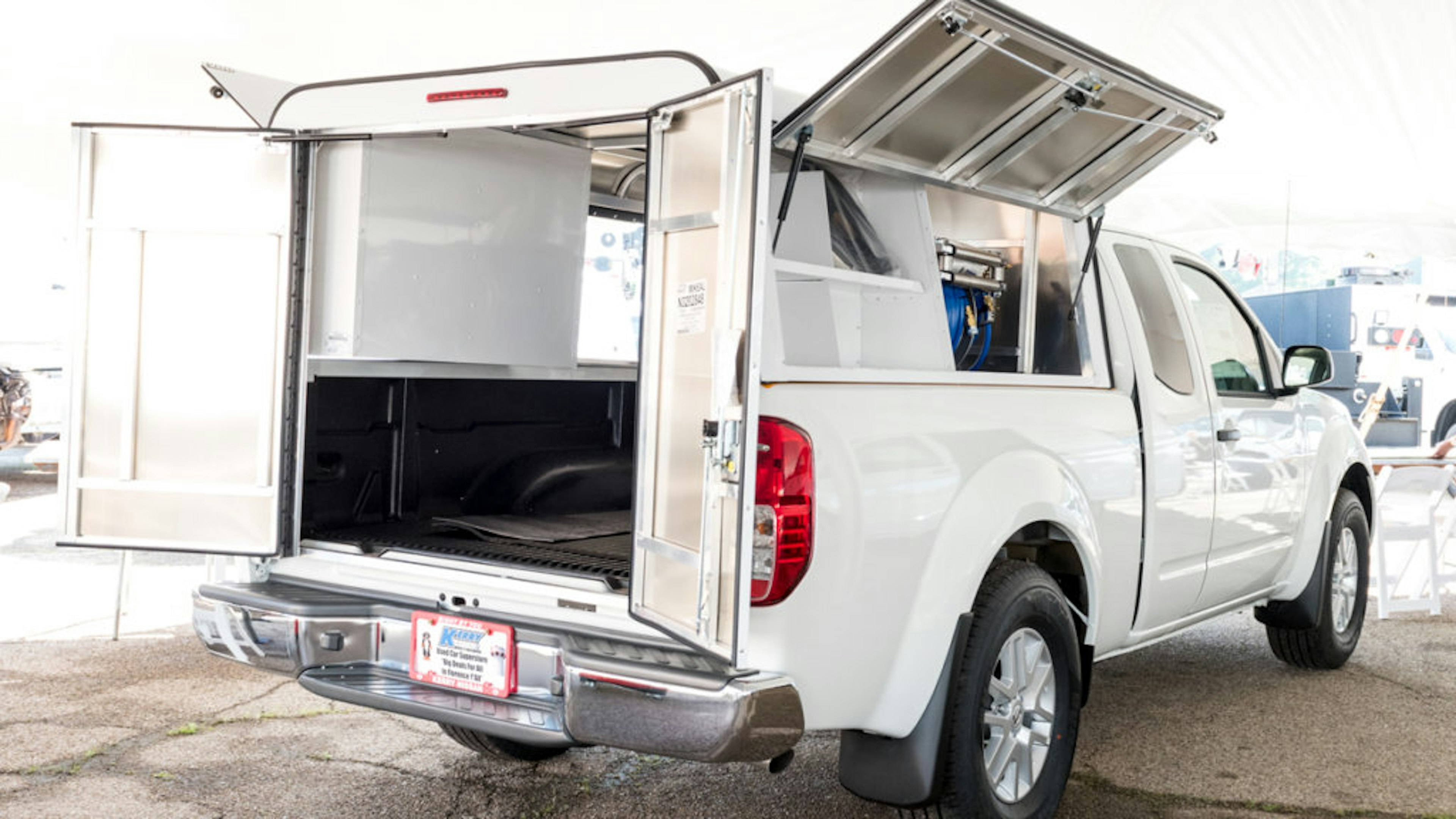 Pickup truck with cap and sprayer