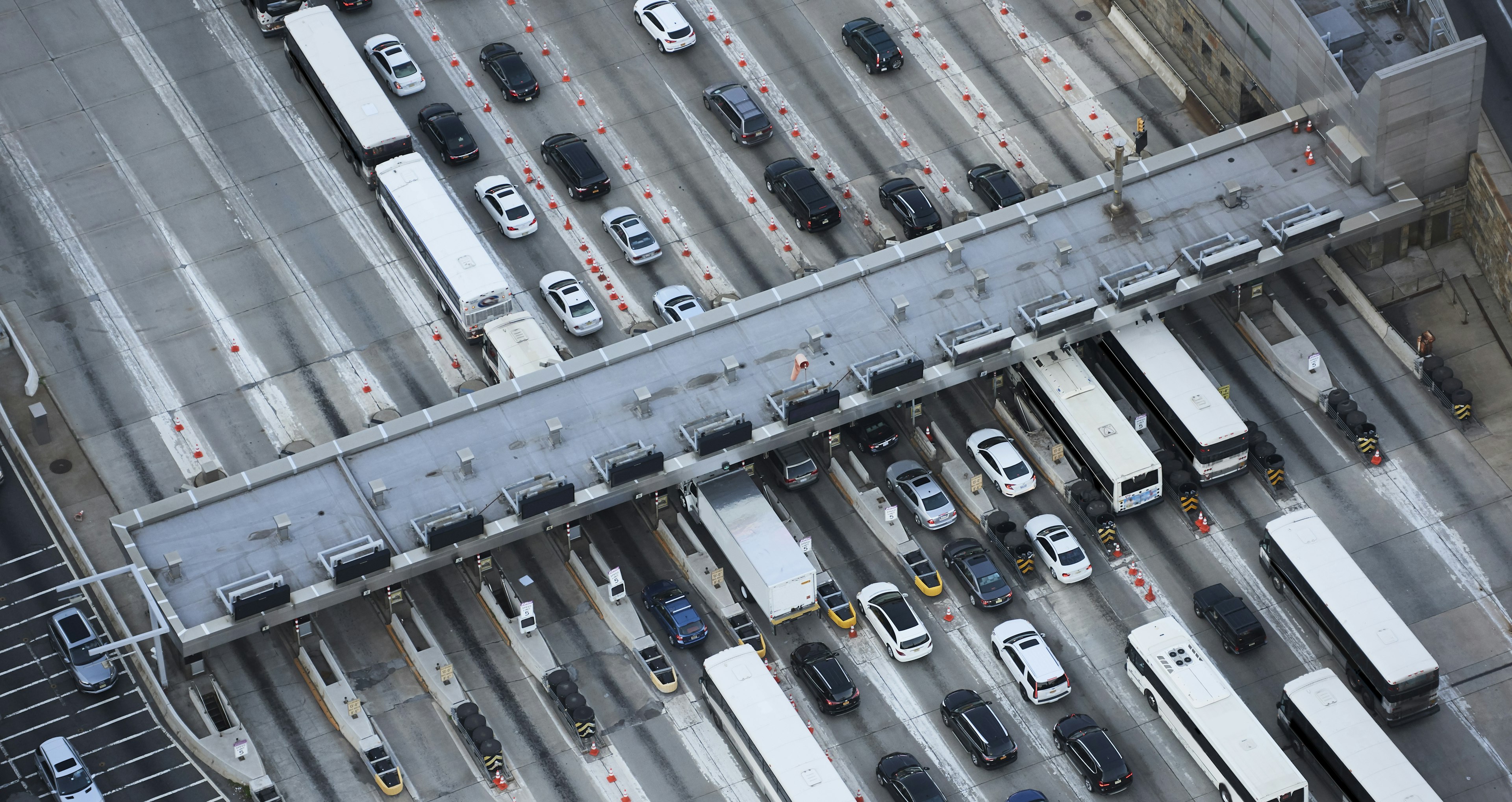 vehicle waiting in a tolling booth line