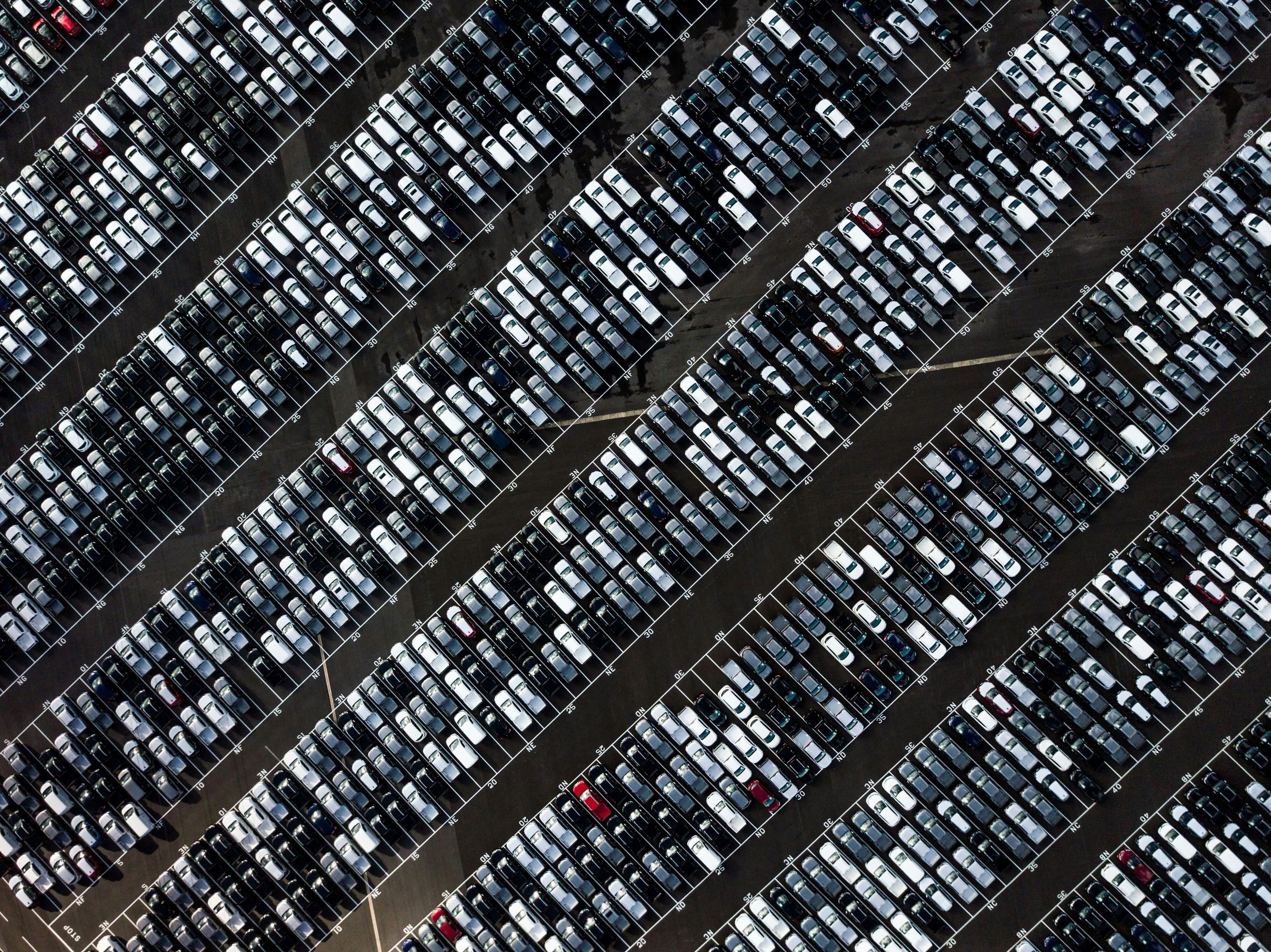 parking lot full of different types of vehicles