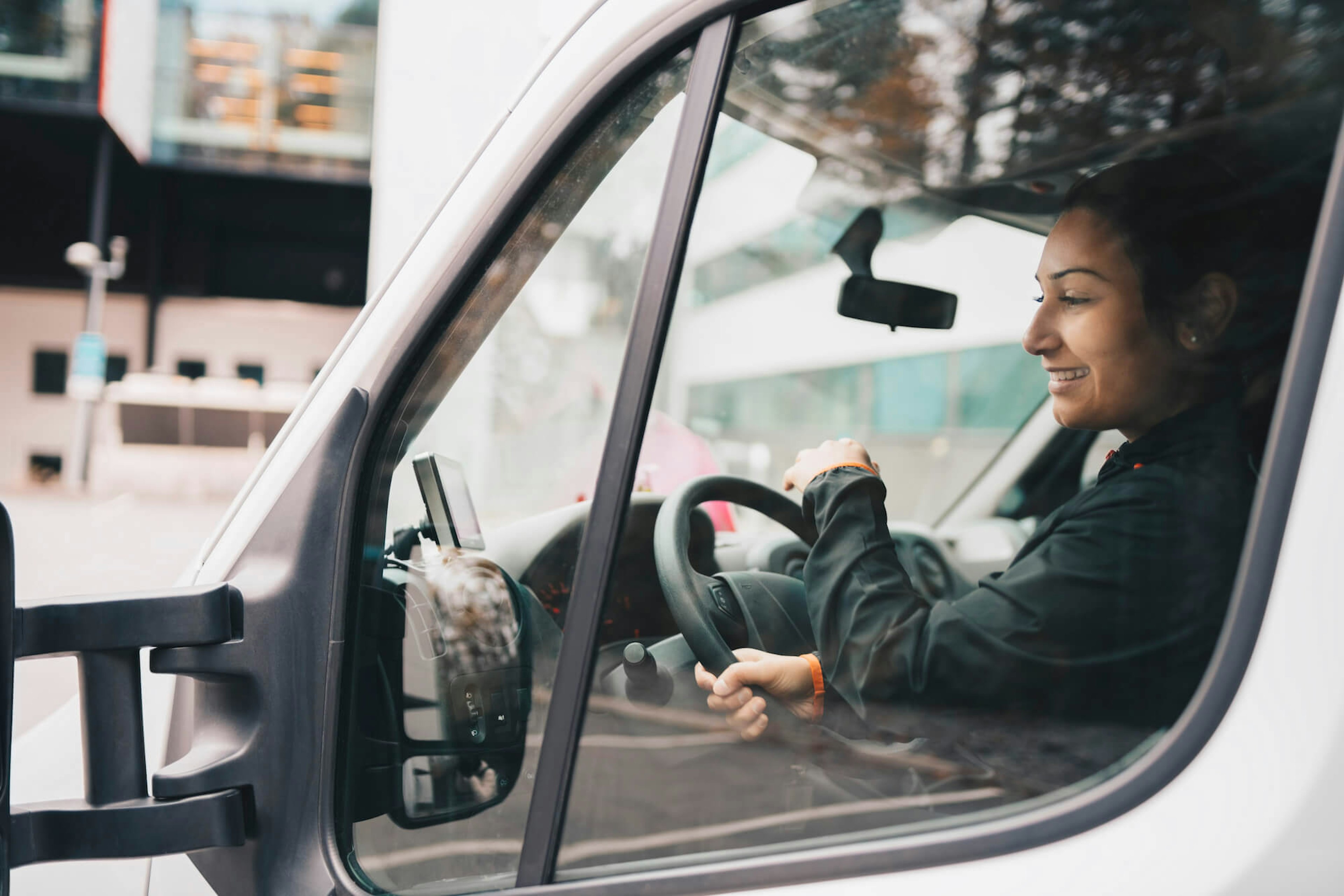 woman driving service van