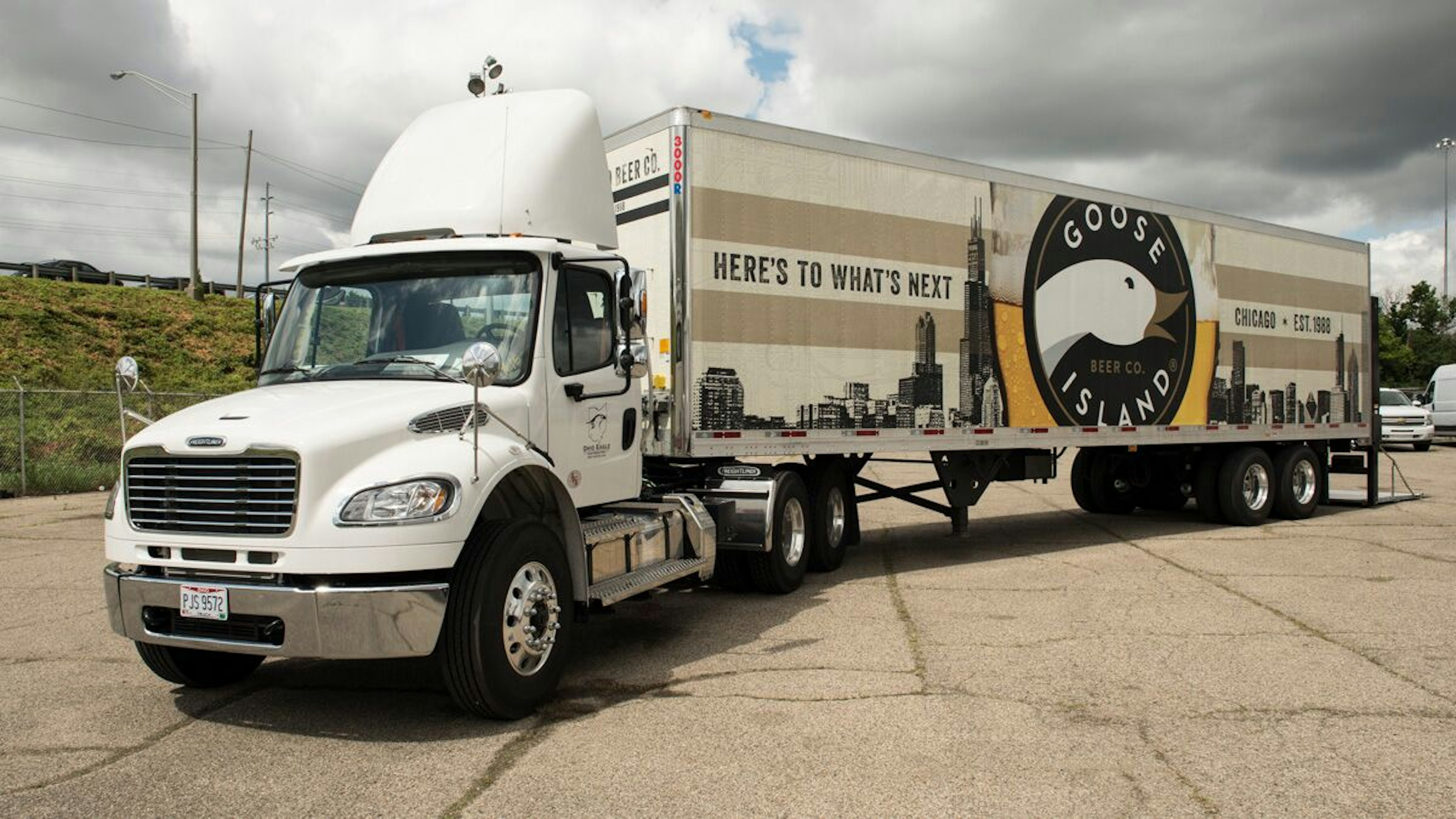 Heavy duty truck with custom wrap and rear lift