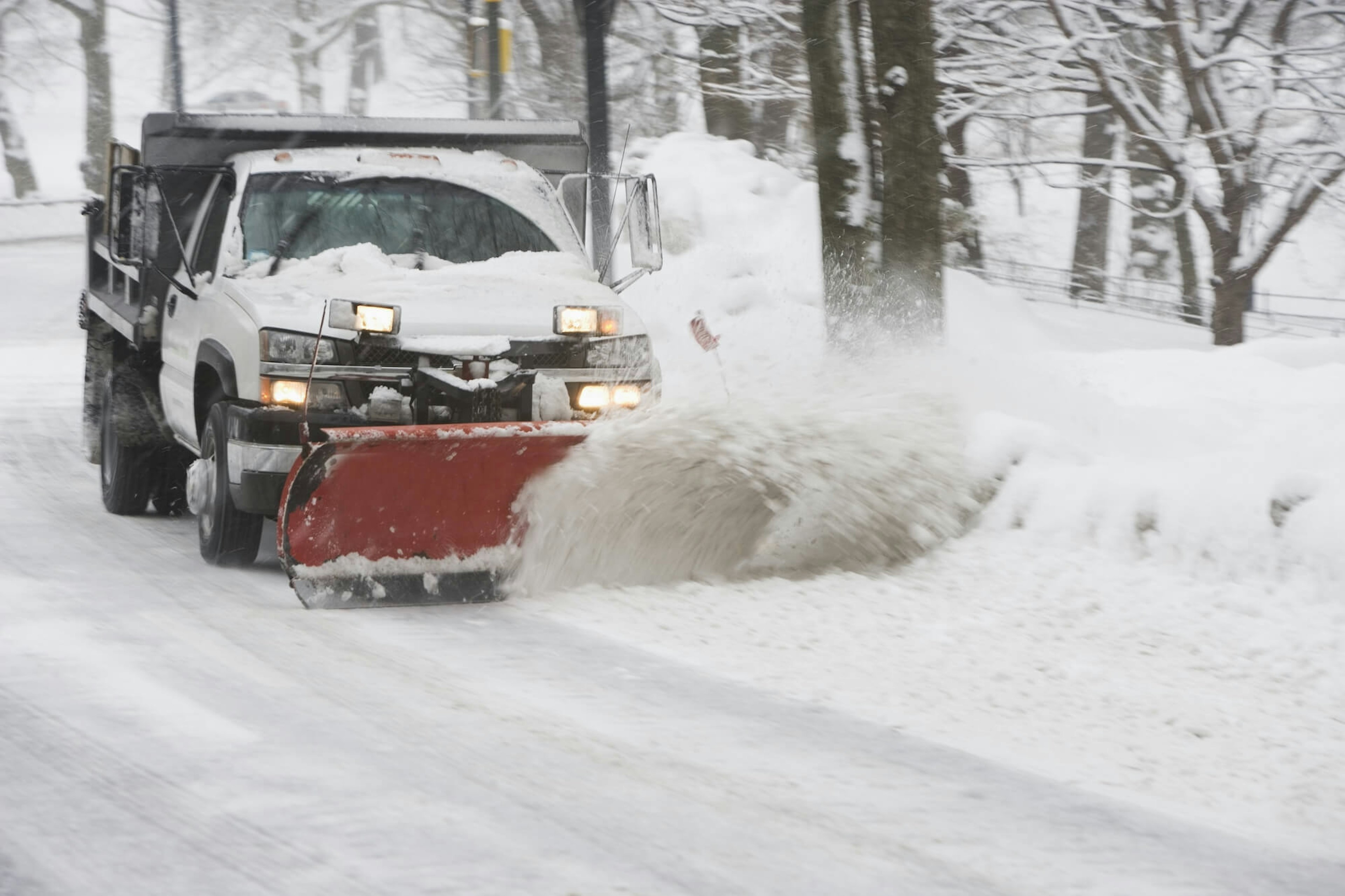 Municipalities Truck Plowing Snow in the Winter