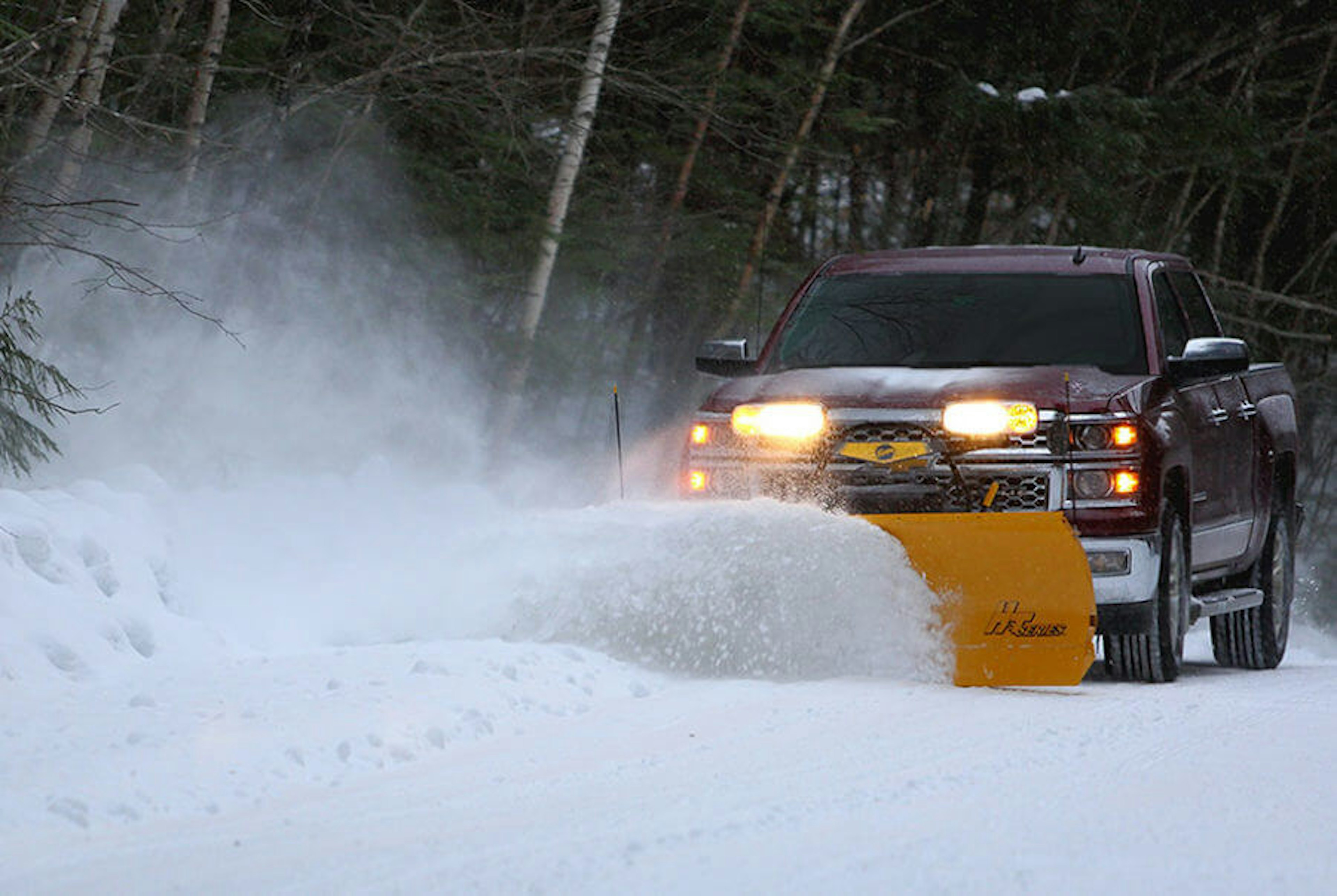 Light Truck Pushing Snow with Plow
