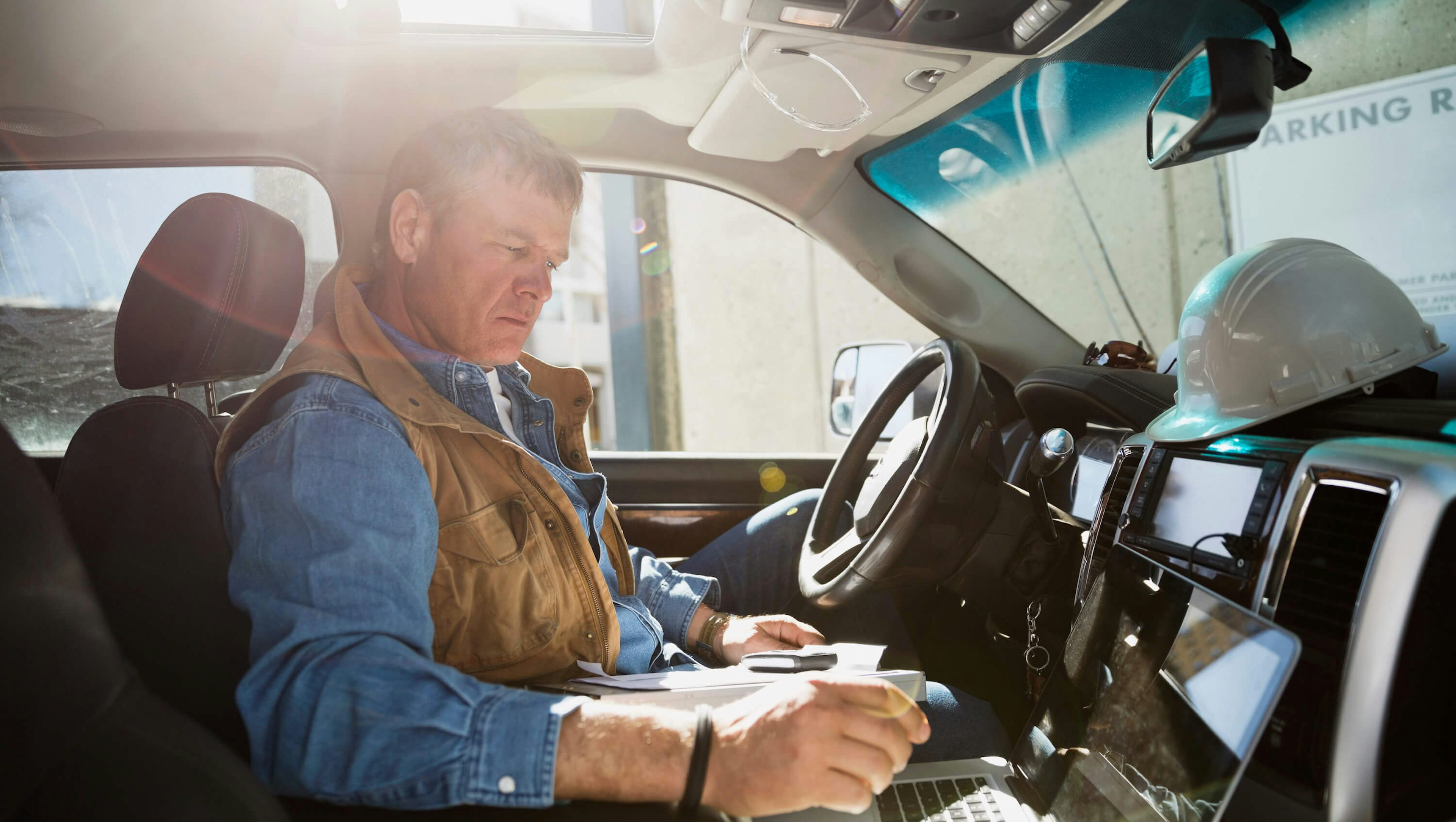 construction worker inside pickup truck