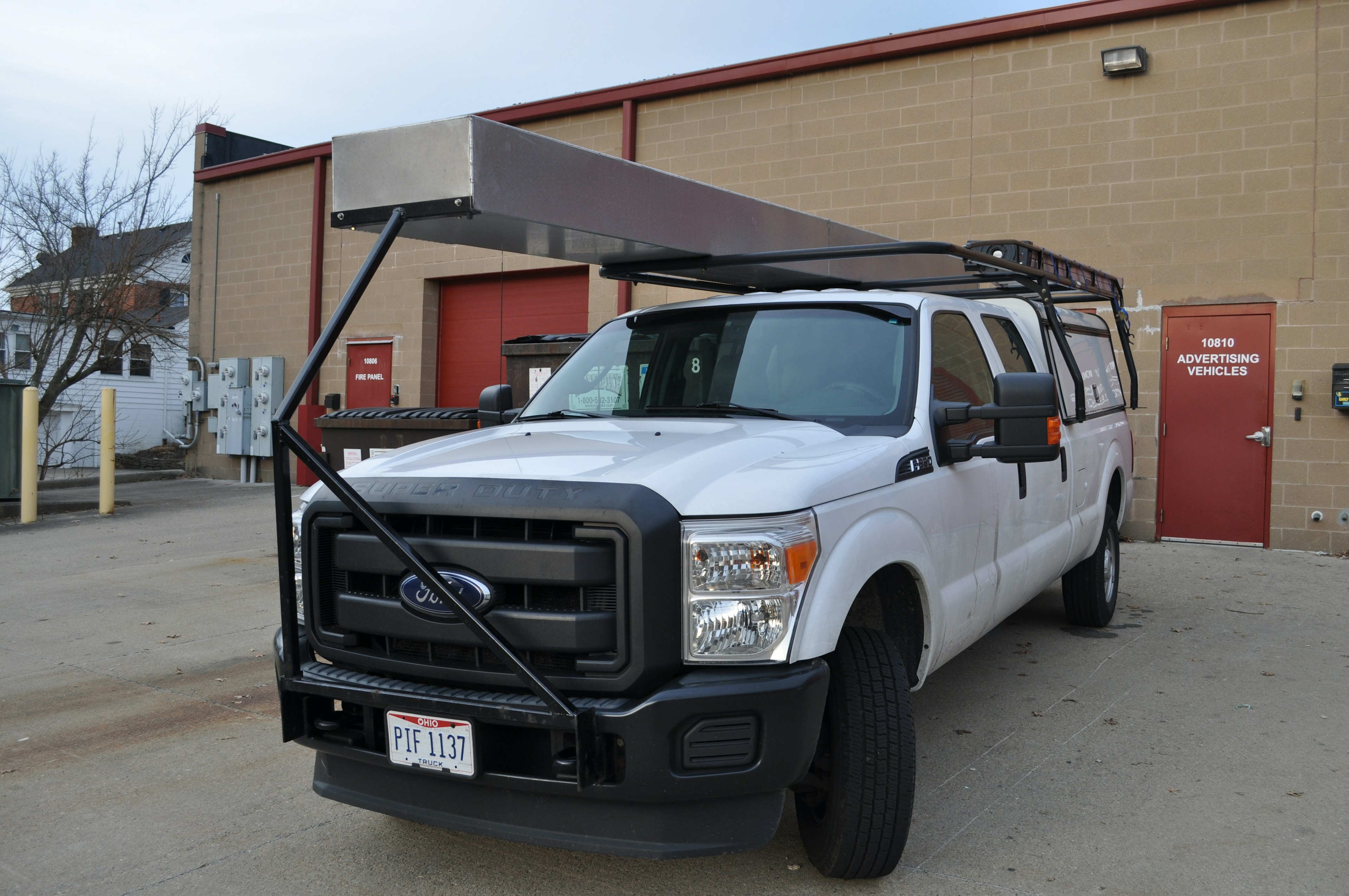 Custom overhead storage rack with bumper support