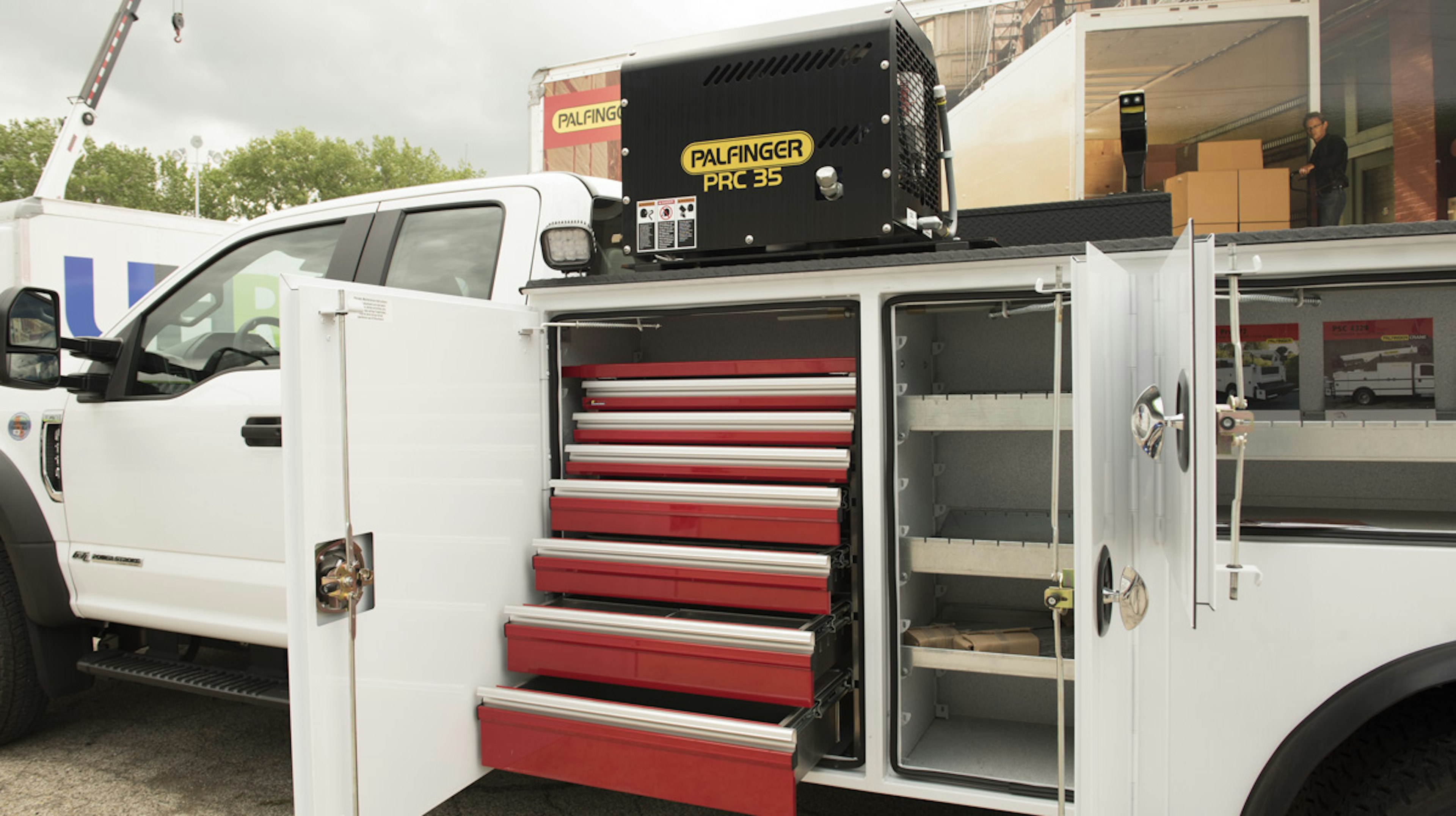 utility accessories such as tool boxes and generator on the back of a service truck