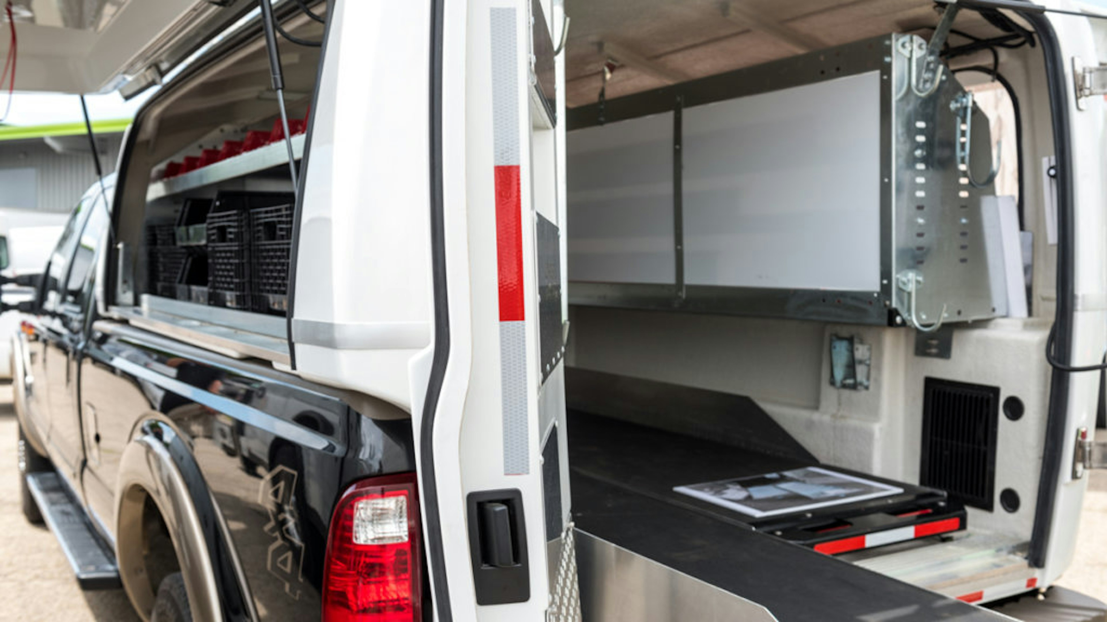 Composite body on the back of a light pickup truck