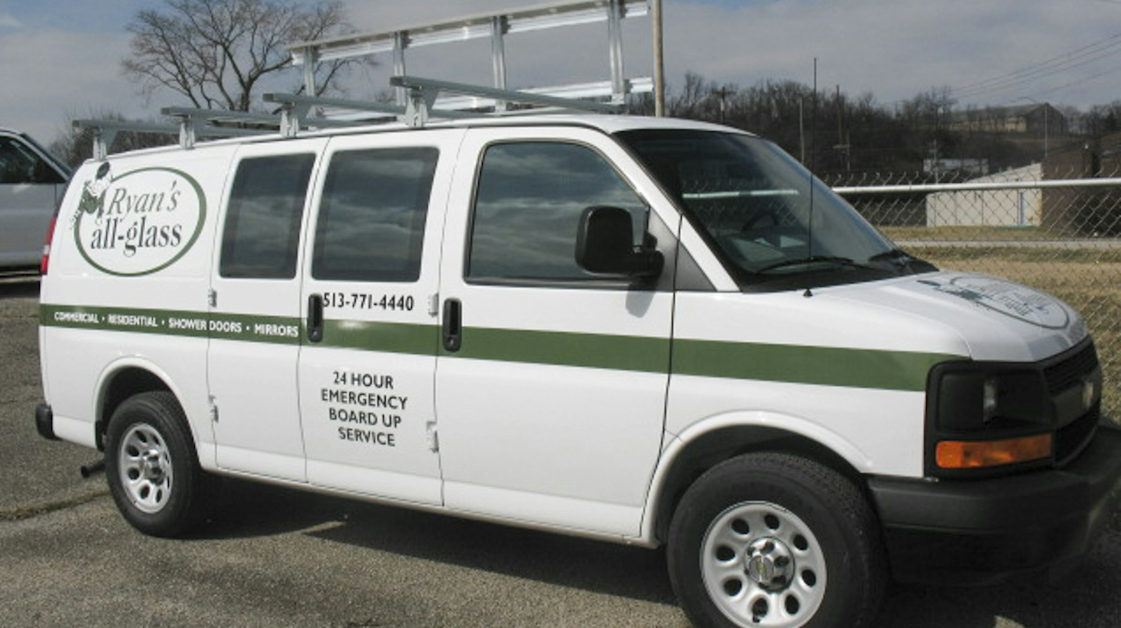 Branded glass delivery van with glass storage on the roof
