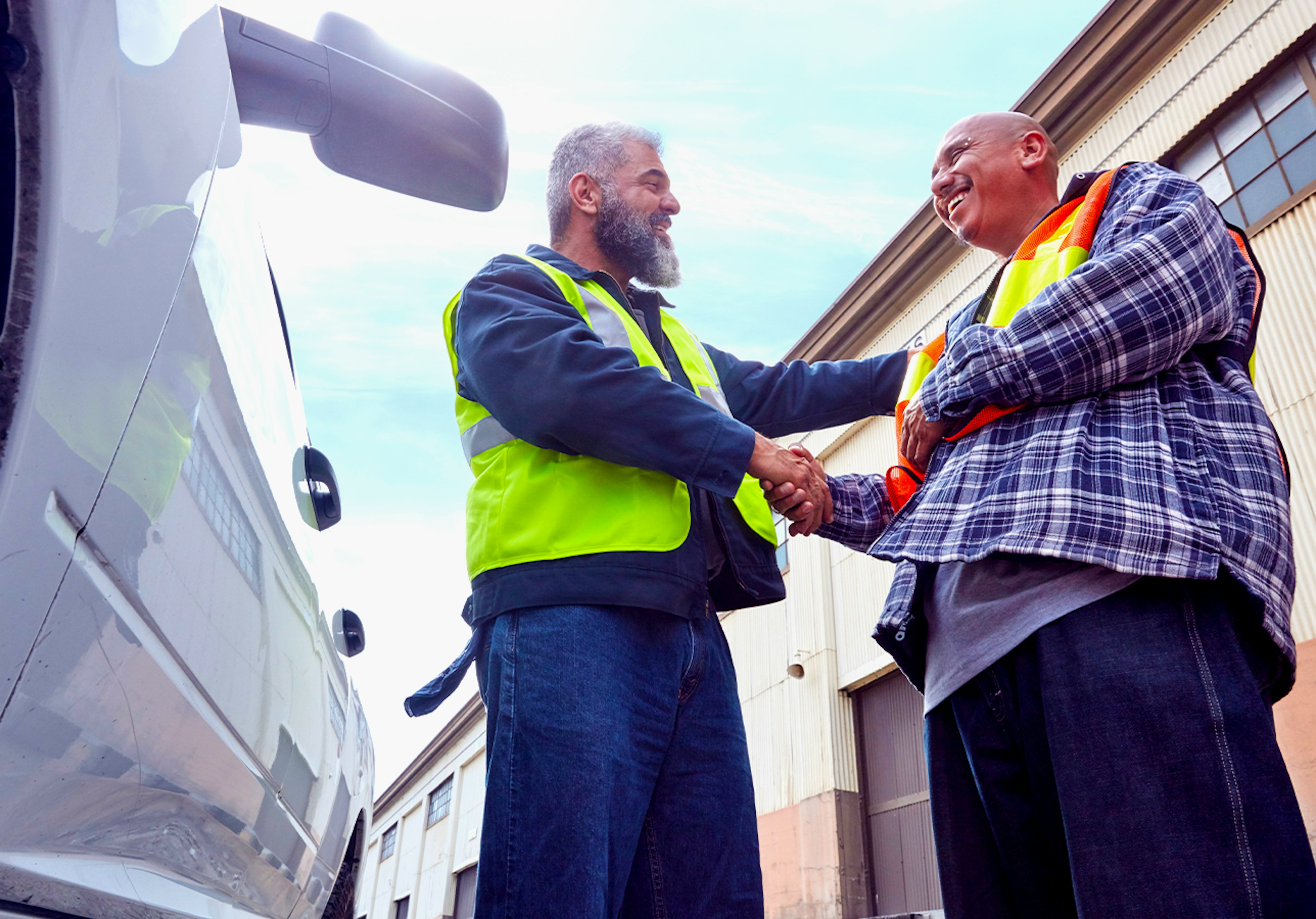 Fleet manager and driver with fleet vehicle.