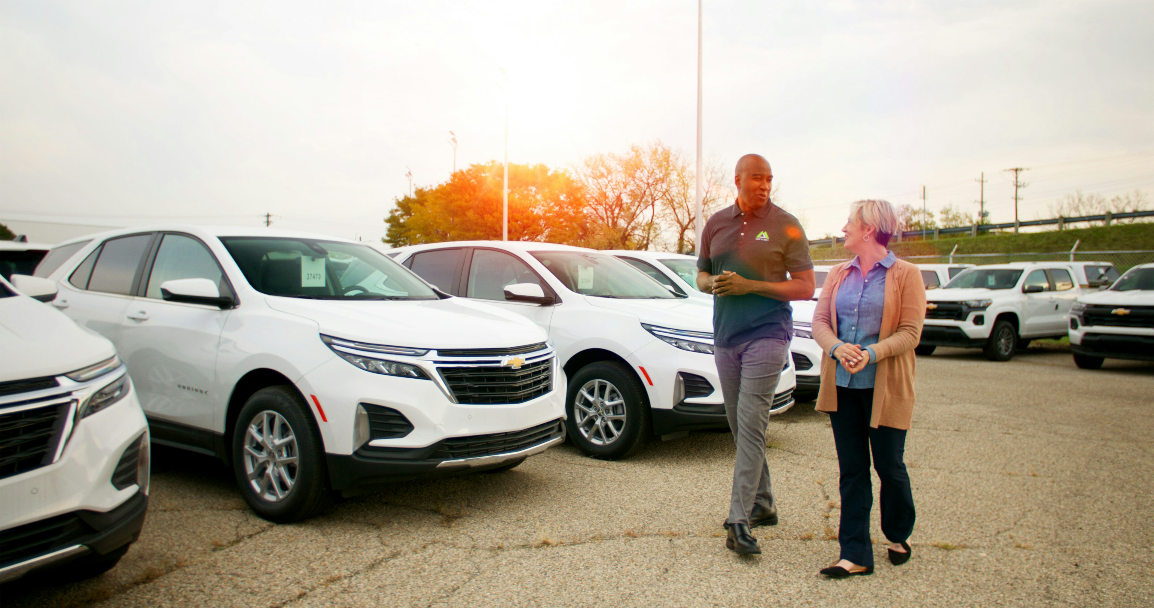 fleet manager and fleet consultant walking through fleet lot
