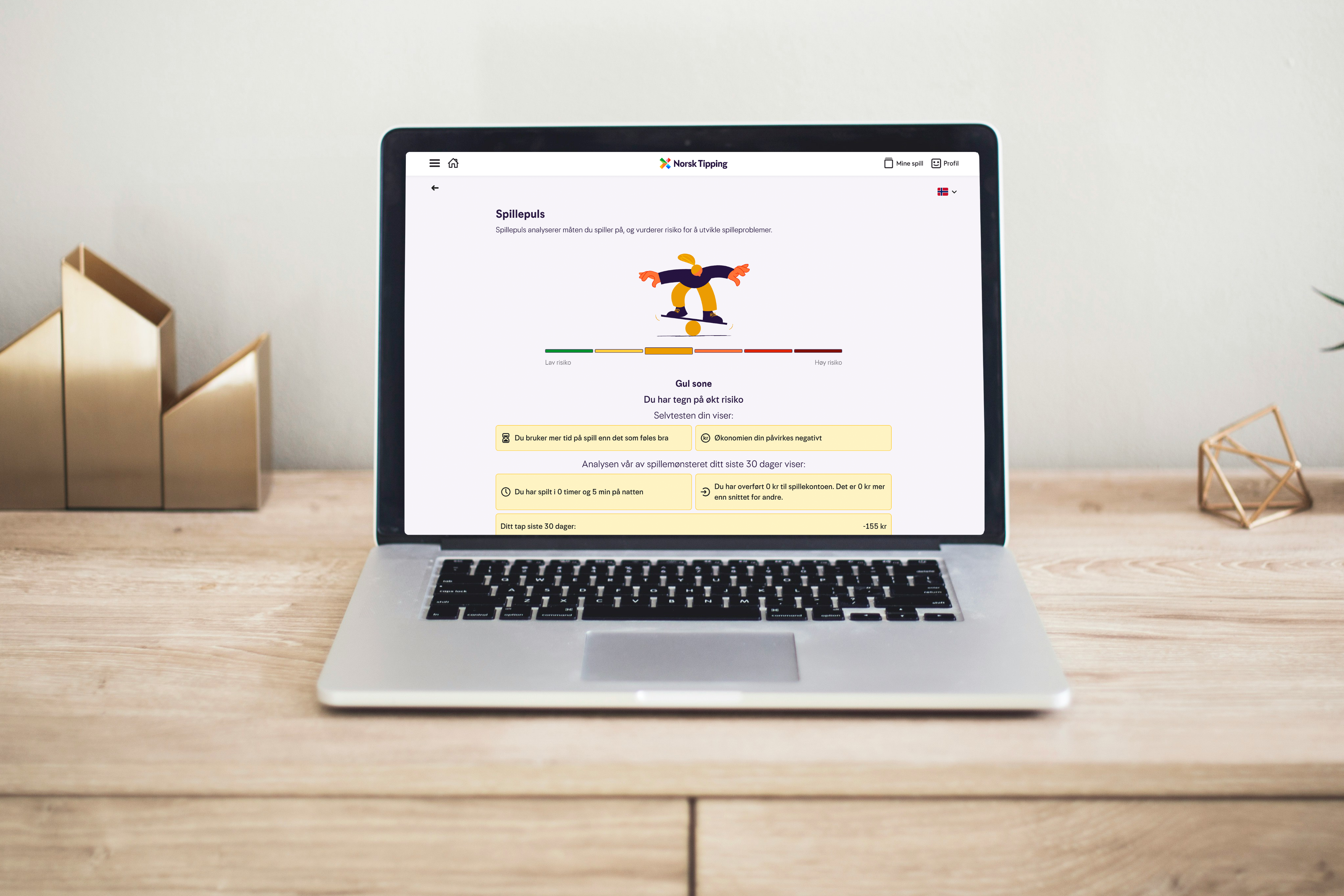 Viser bilde av laptop med med illustrasjonsbilde av gul status på spillepulssidene. Gul status betyr at du har tegn på økt risiko.
