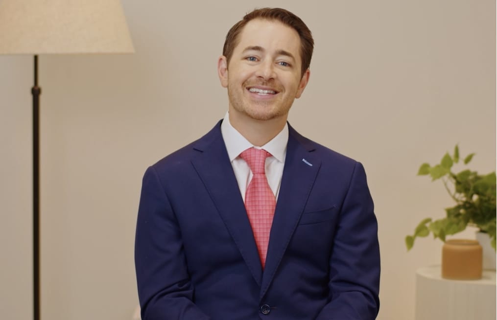 Dr. Robb smiling and talking during a video.