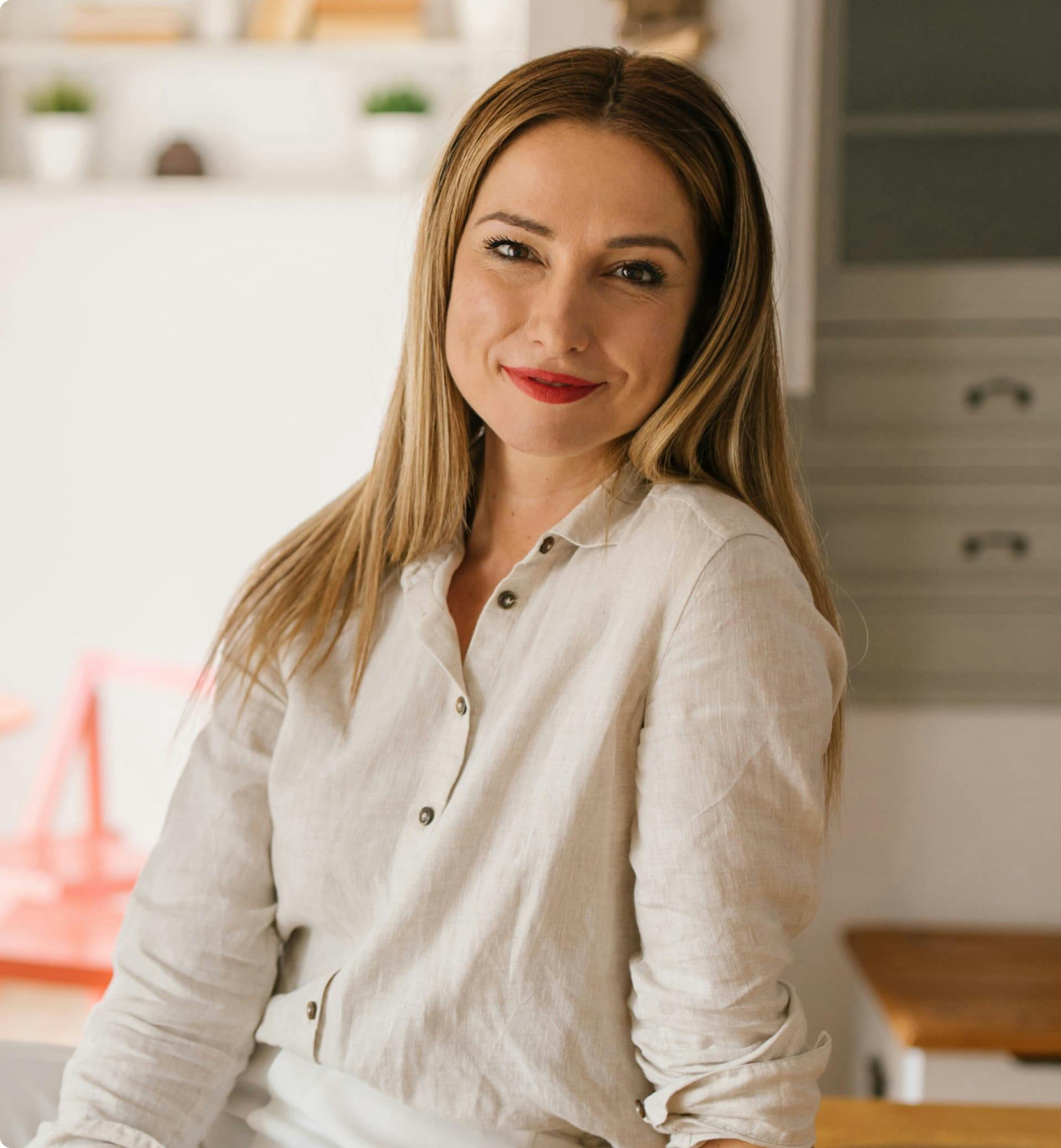 Woman smiling in a home.