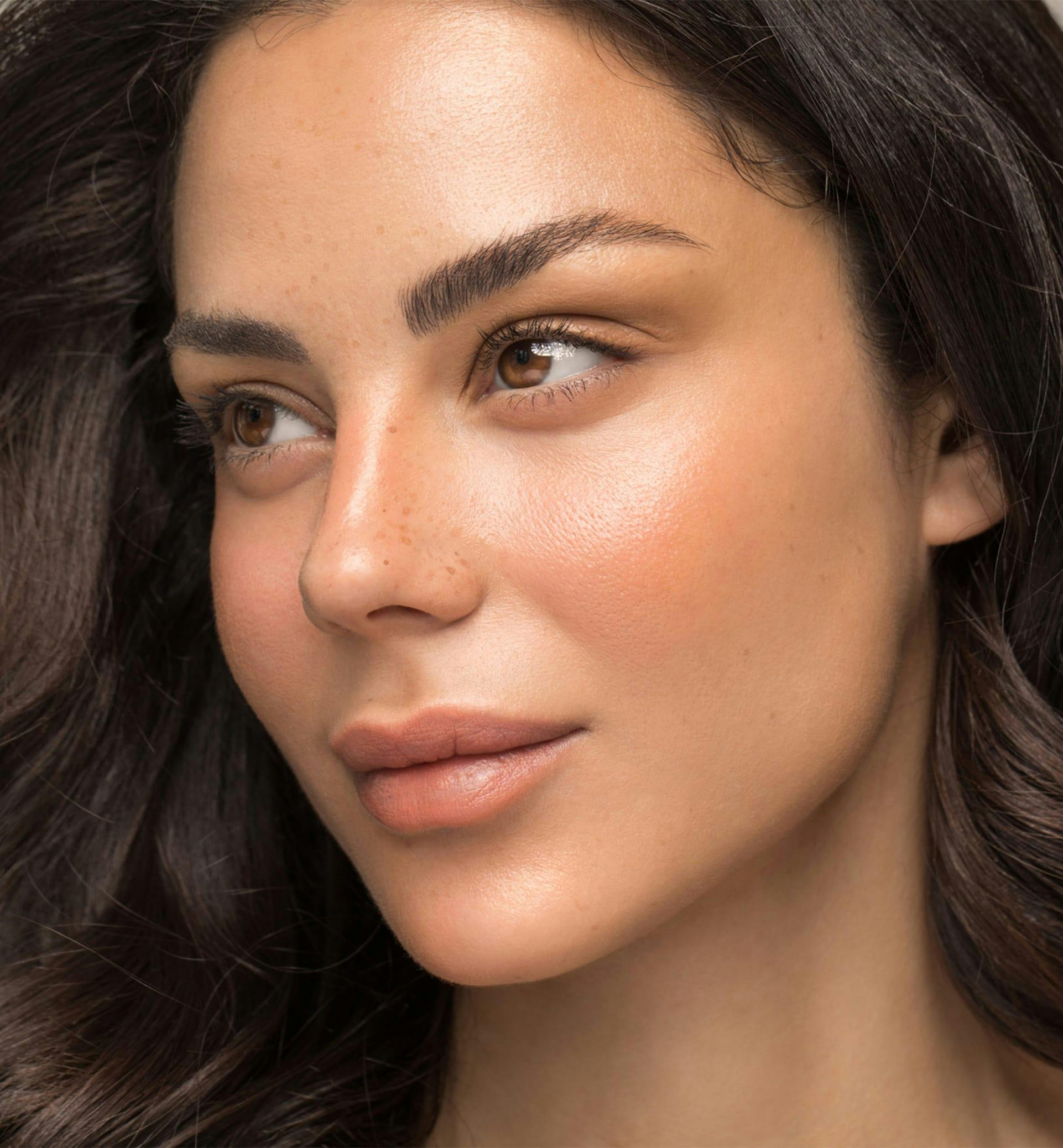 brunette woman with close up of nose