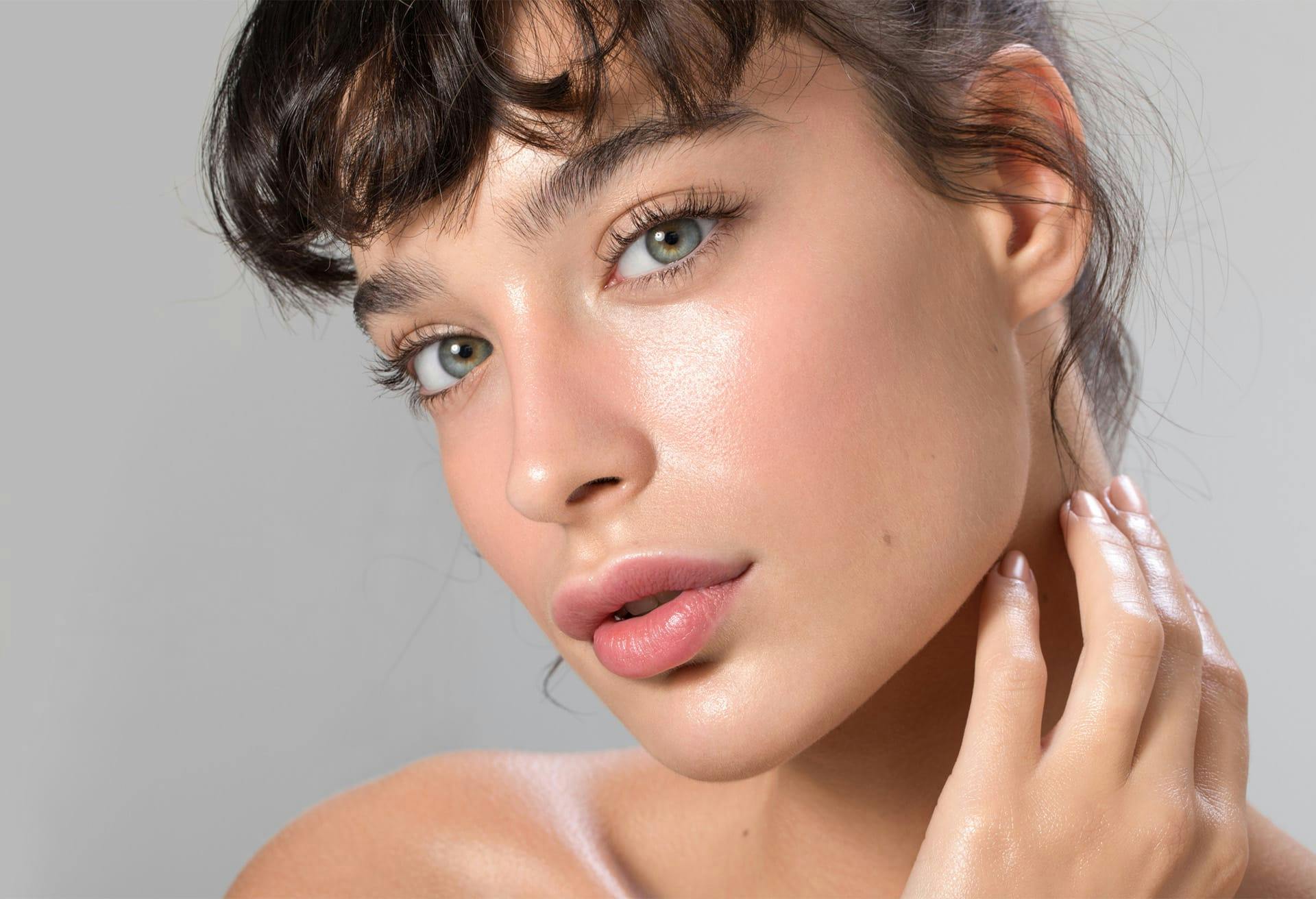 young brunette model with clear skin and little makeup