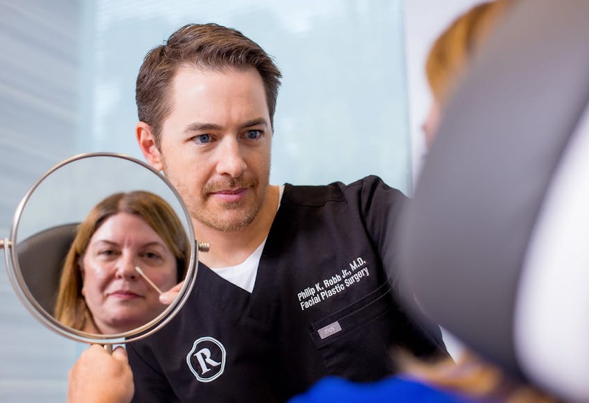 Dr. Robb helping a patient.