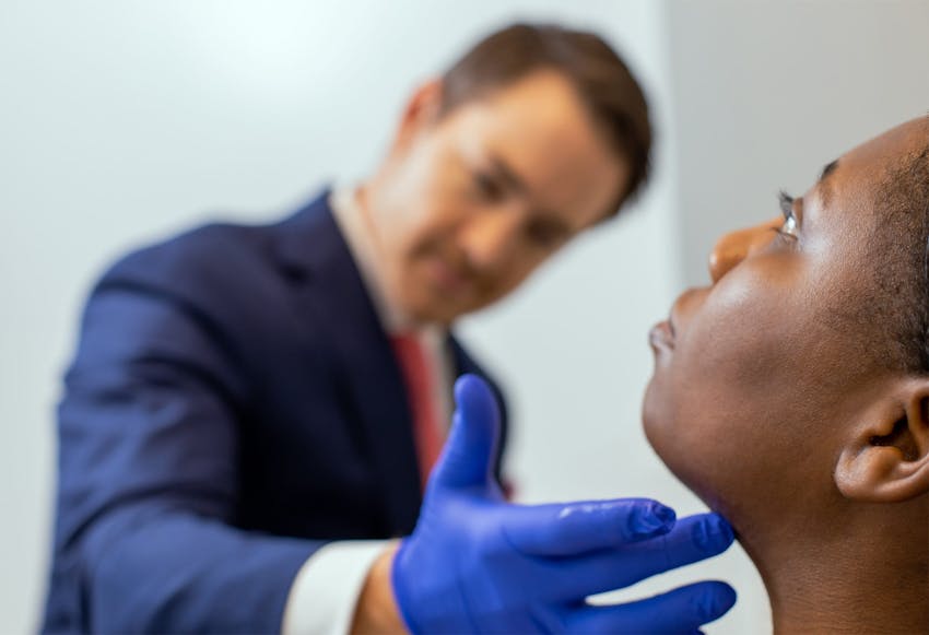 Dr. Robb doing a liposuction consultation on a patient