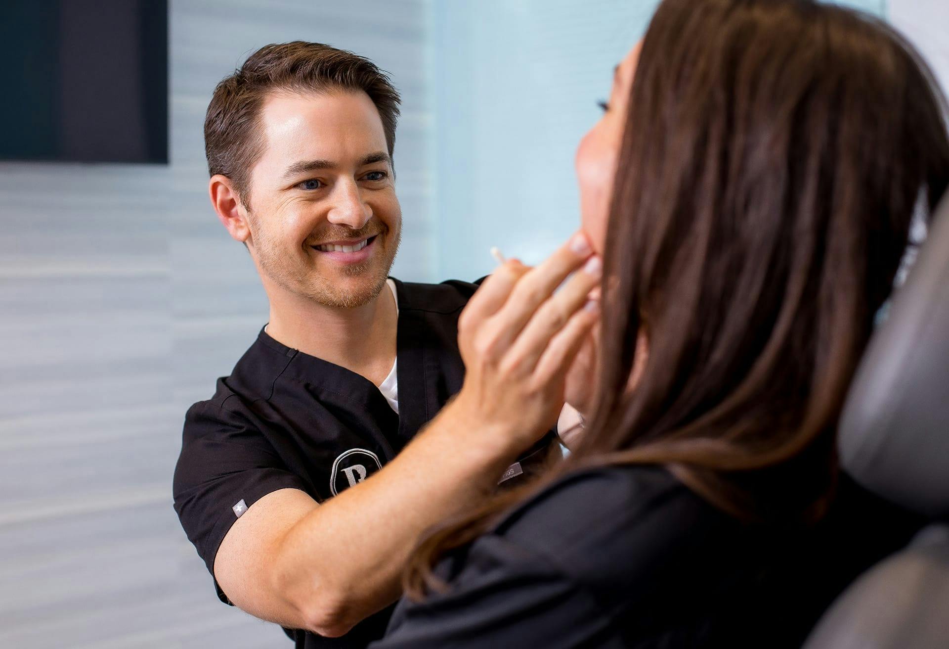 Dr. Robb doing a chin enhancement consultation on a patient
