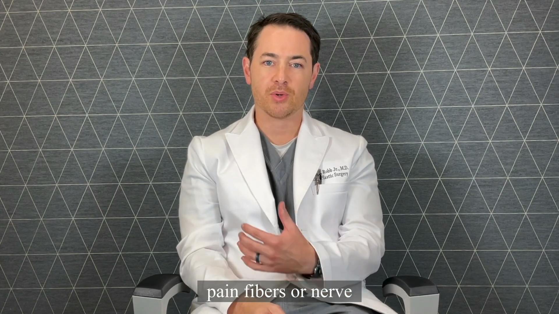 an image of Dr. Robb doing an interview in a white lab coat