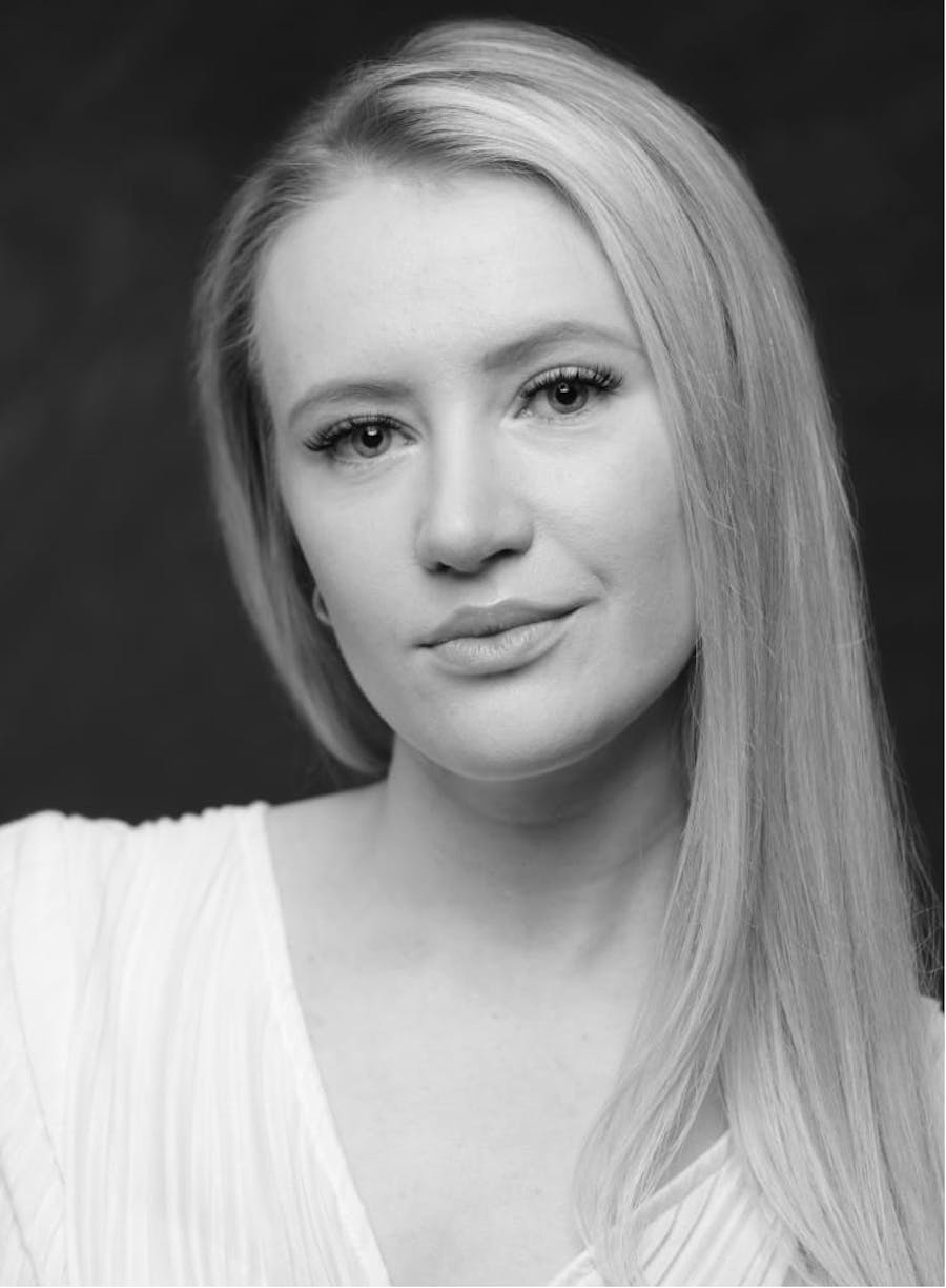 Black and white photo of a blonde woman.