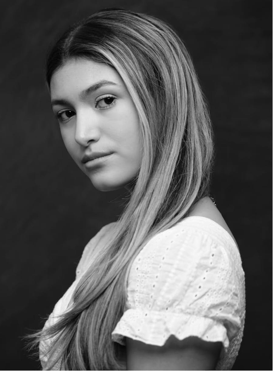 Black and white photo of a girl looking to the side.