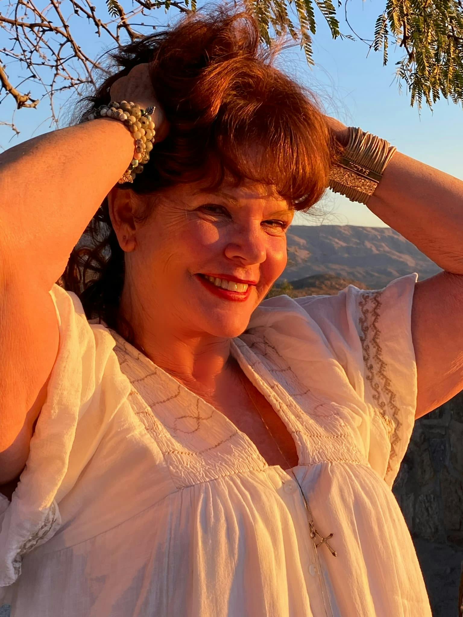 Woman smiling by the sunset