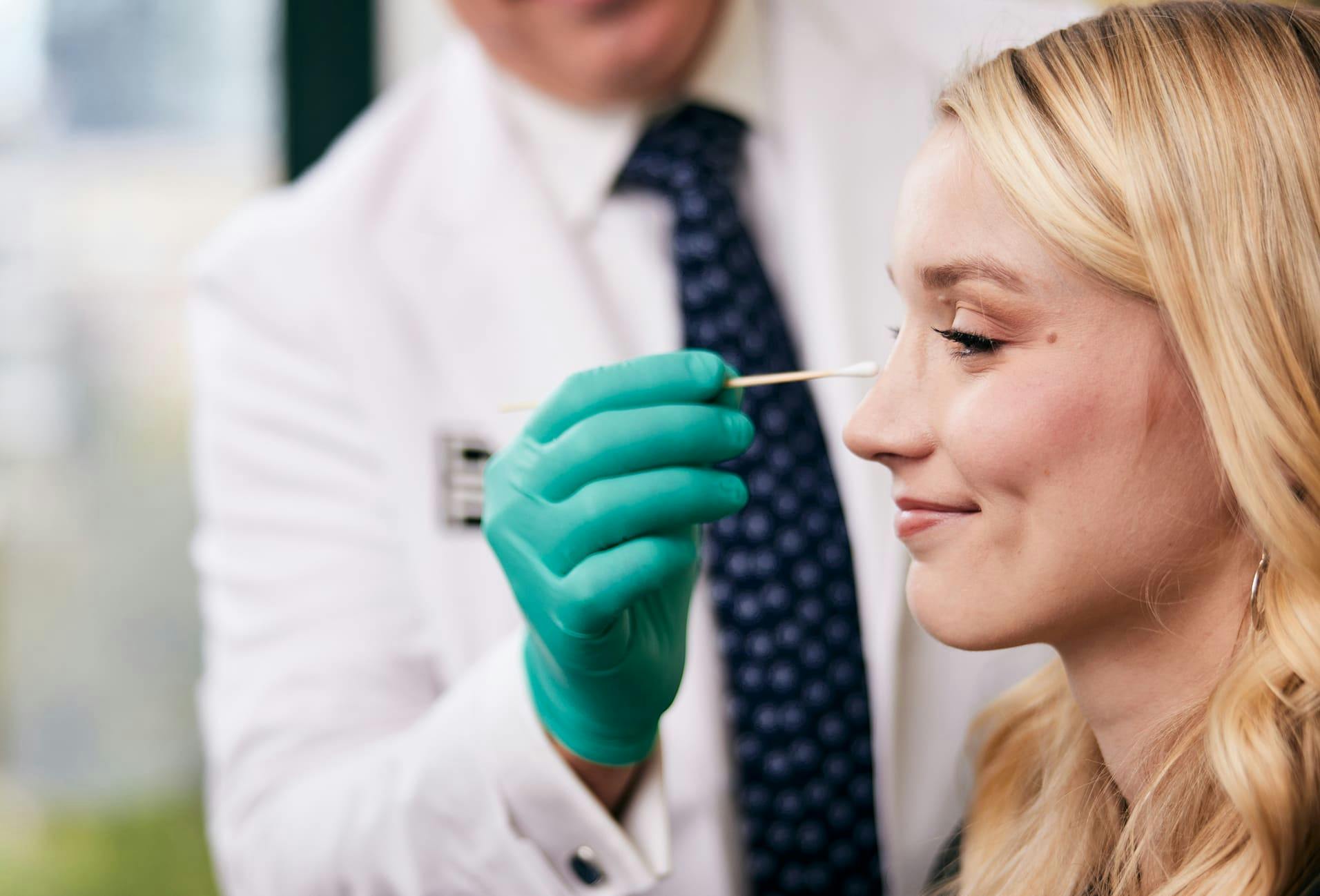 Dr. Moynihan Examining patient nose