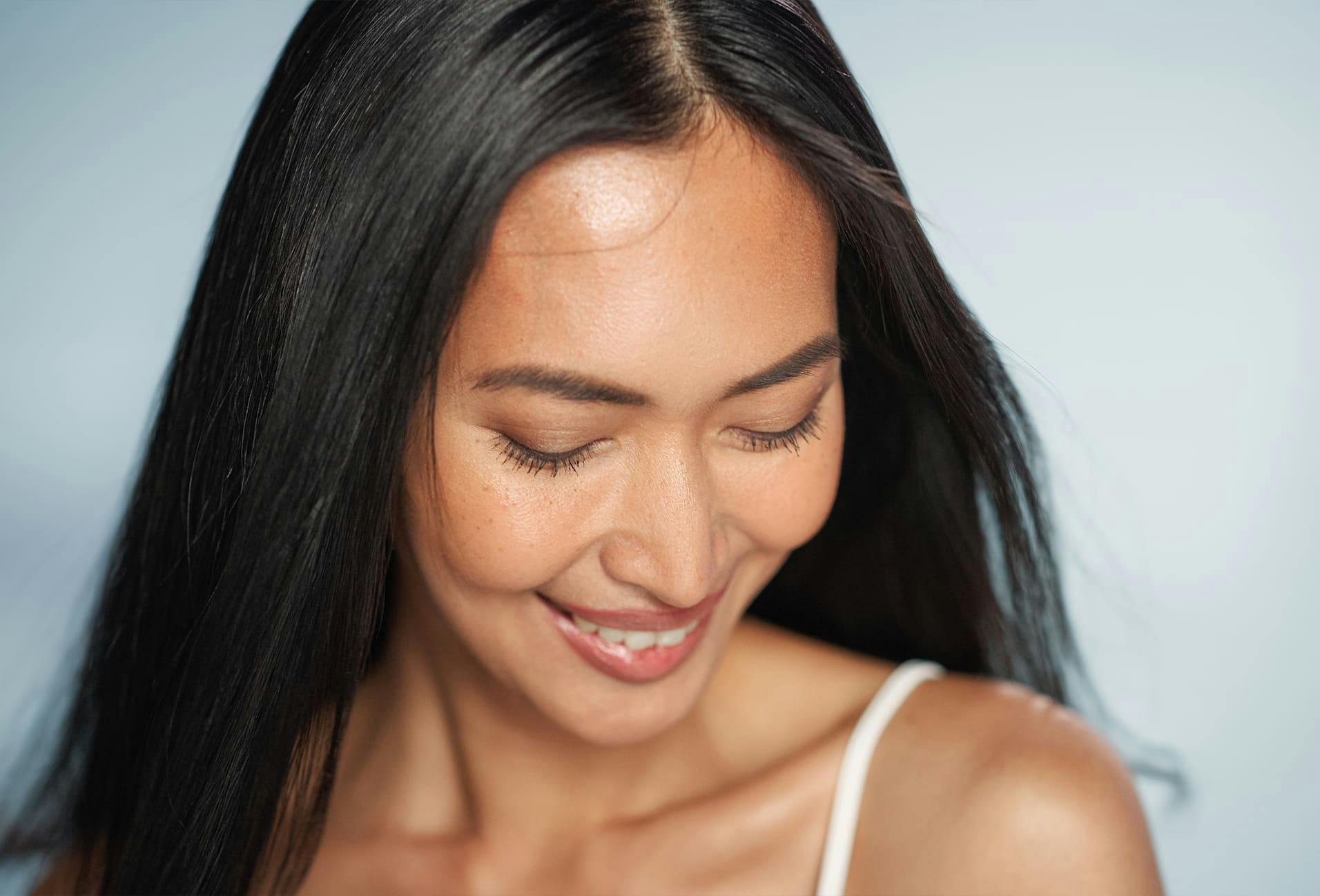 Woman smiling and looking down