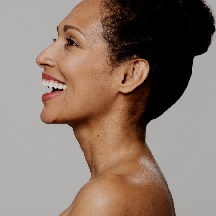 Woman smiling and facing right